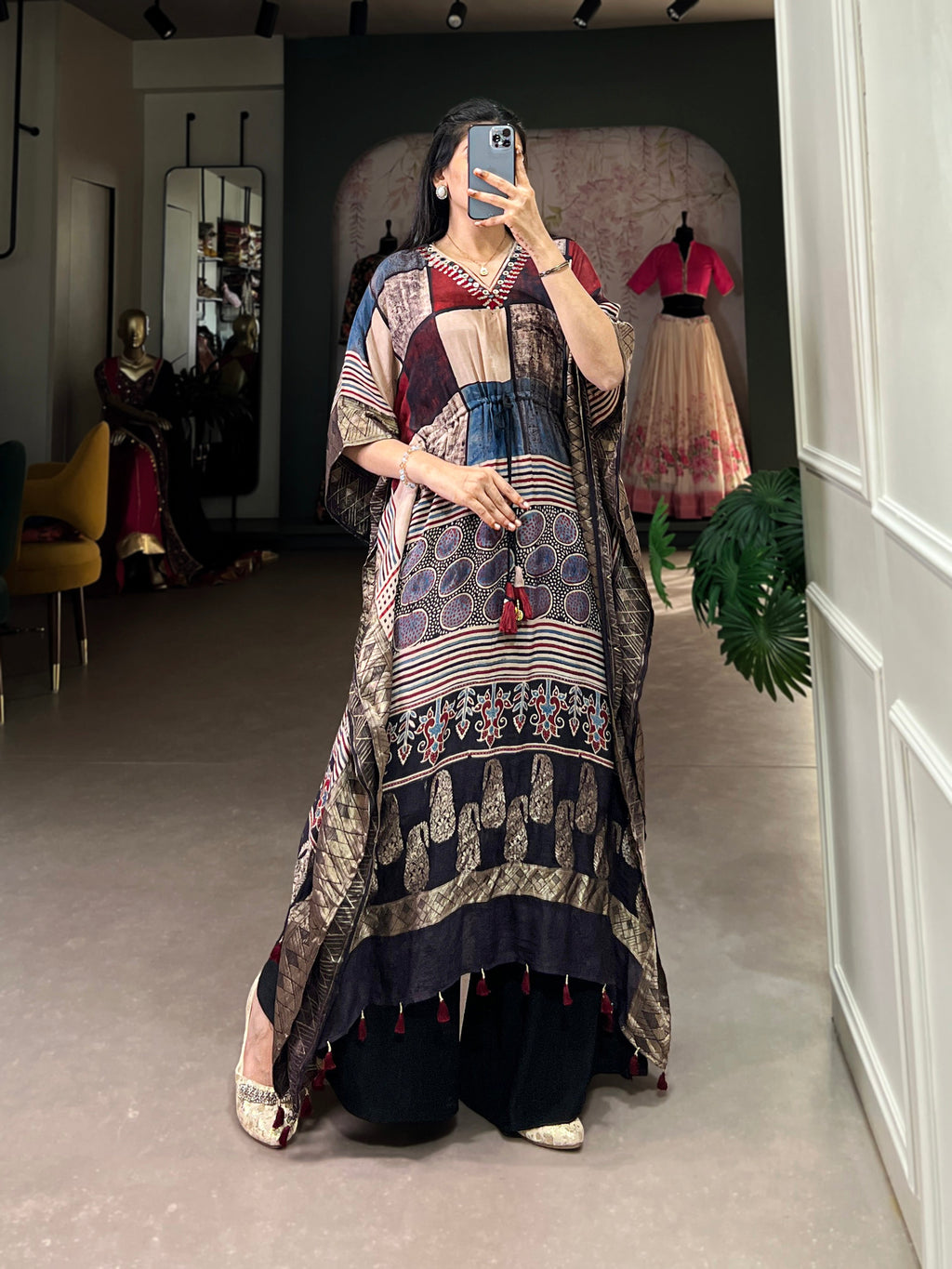 Elegant woman modeling stylish viscose partywear kaftan with zari border design