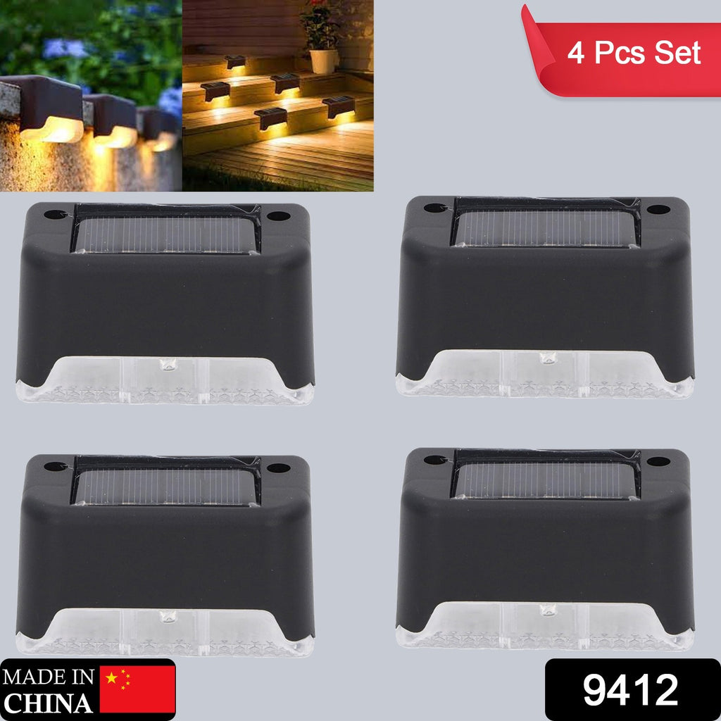 4-pc solar decorative lights illuminating outdoor wooden fence railing and steps at dusk.