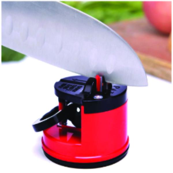 Manual kitchen knife sharpener 2164 in use, sharpening a stainless steel blade.
