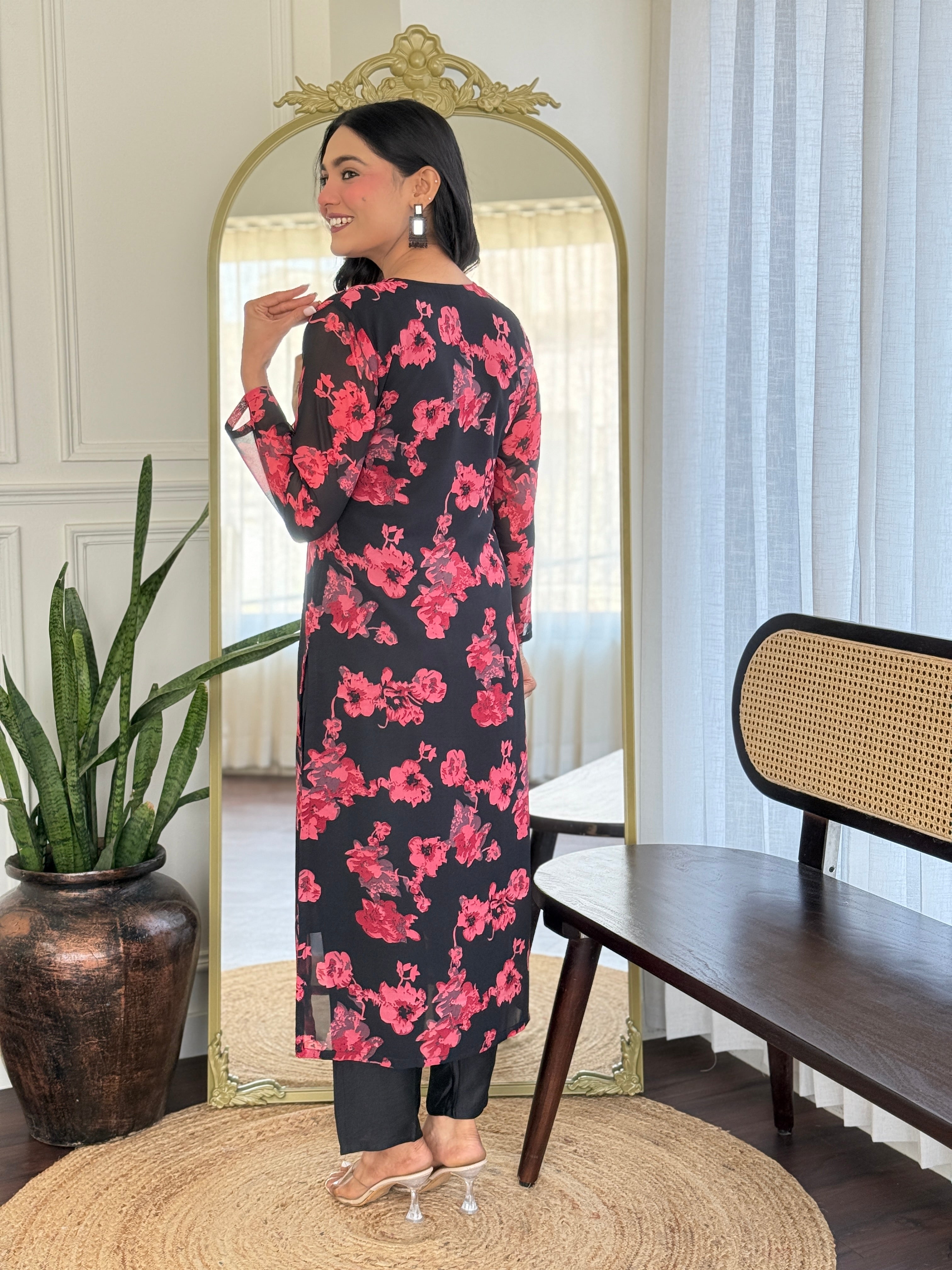 Back view of the model in the TRENDBUY black floral kurti set, showcasing the full length of the kurta and chanderi silk pants.