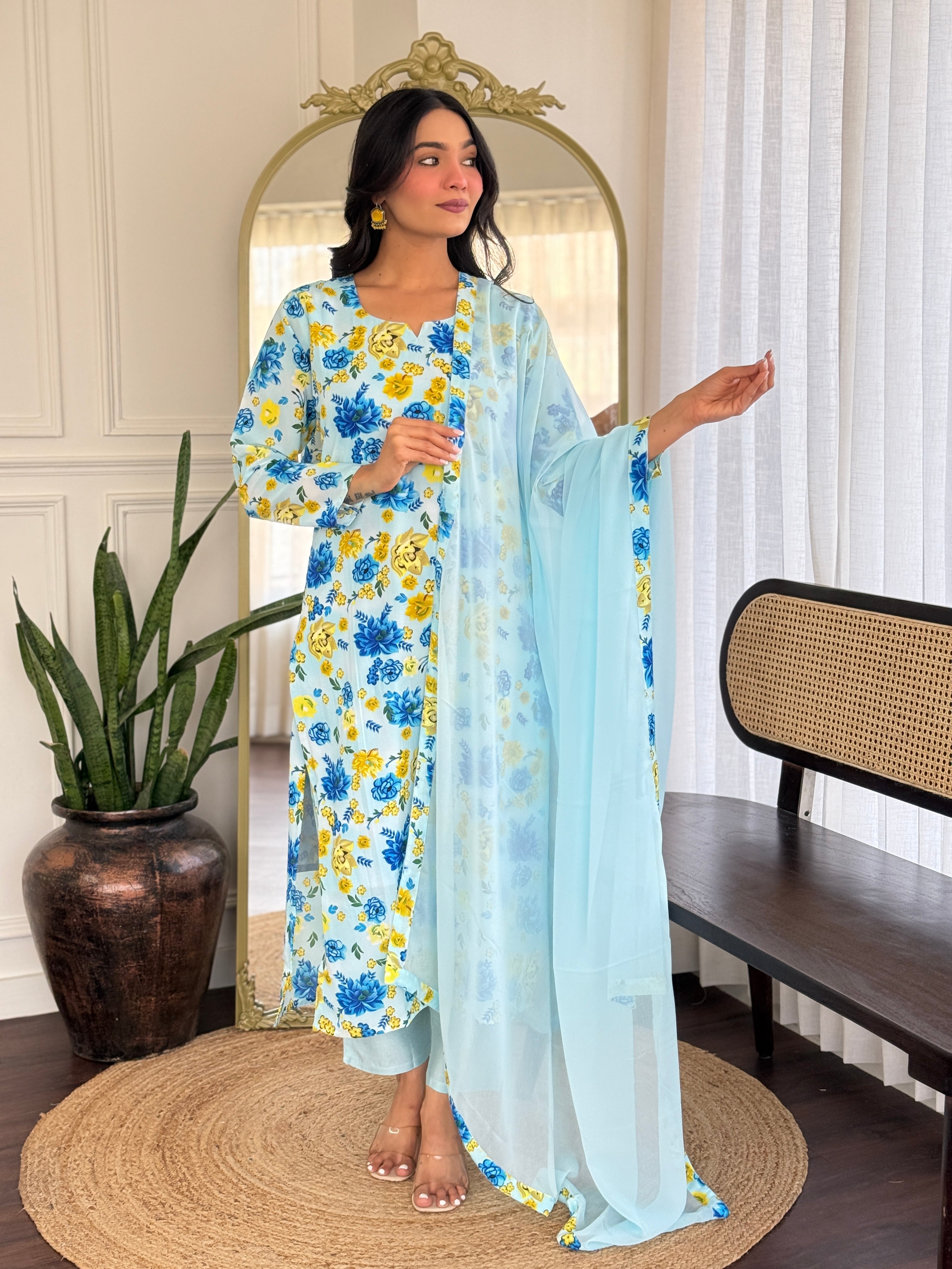 Model in TRENDBUY georgette kurta set, hand gesture showing the fabric flow and print.