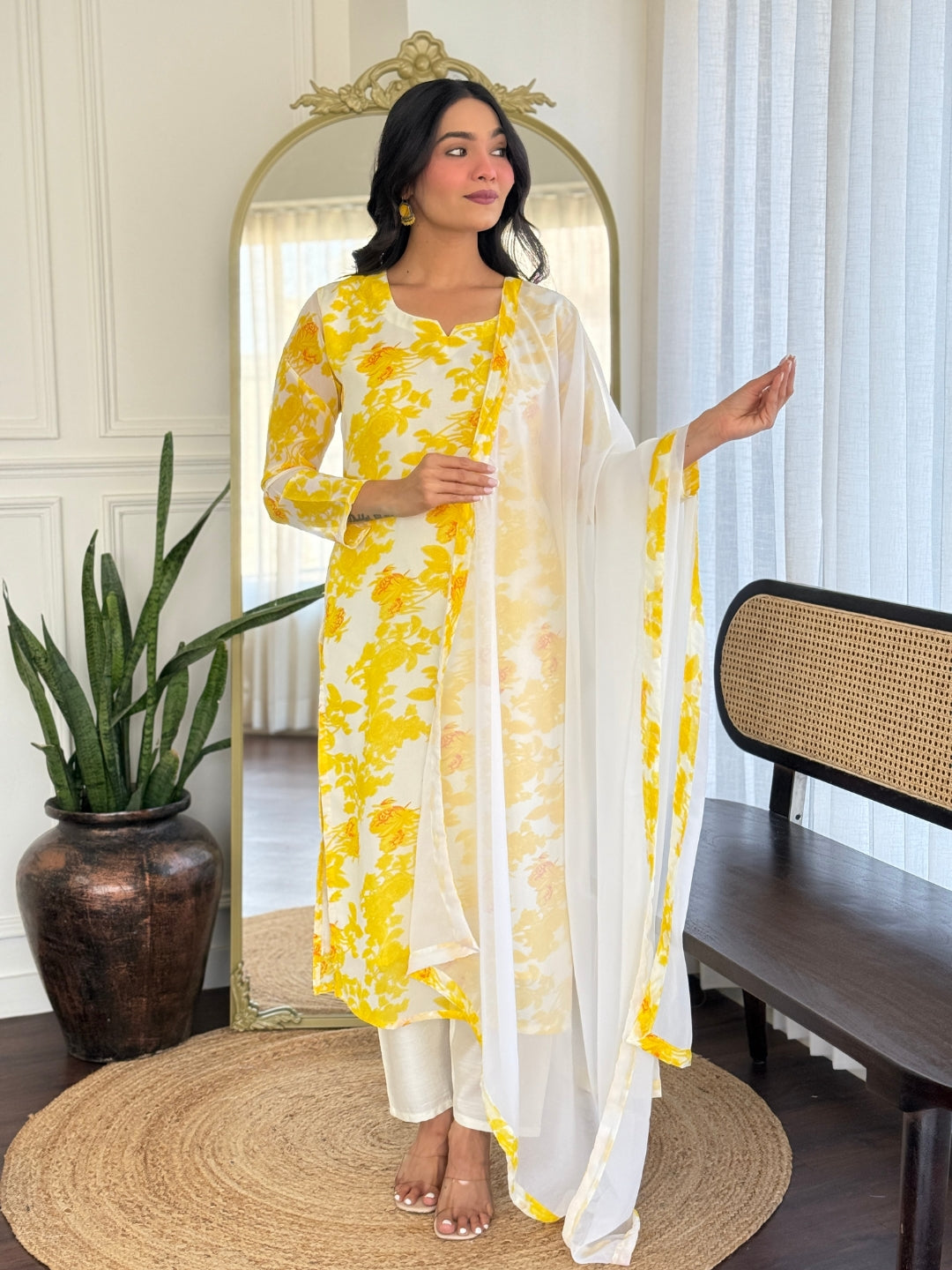 Model showcasing the front view of TRENDBUY yellow floral printed georgette kurti set with white chanderi silk pants and dupatta, standing elegantly