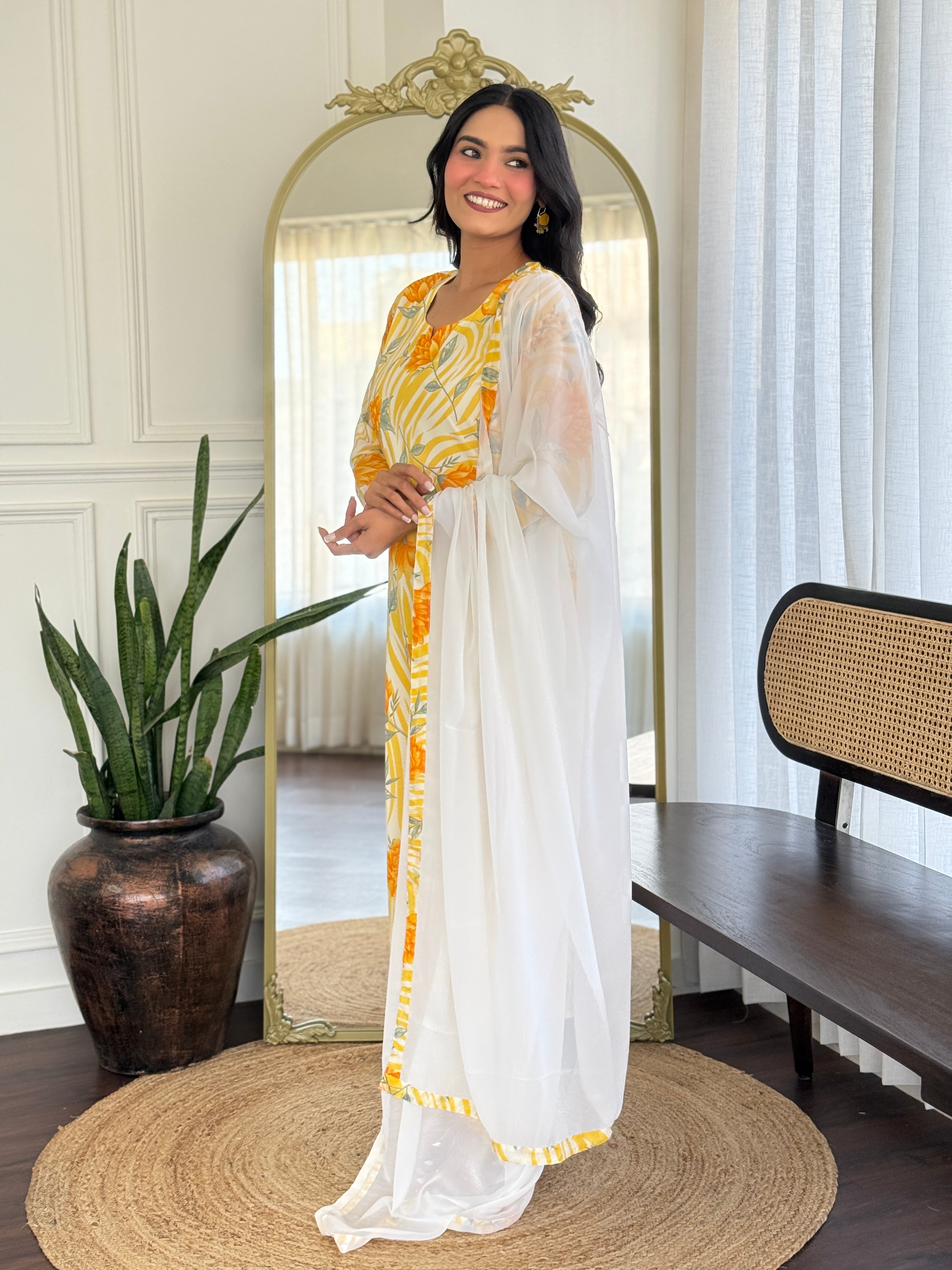 Model gracefully holding the white georgette dupatta, displaying the complete outfit's appeal.