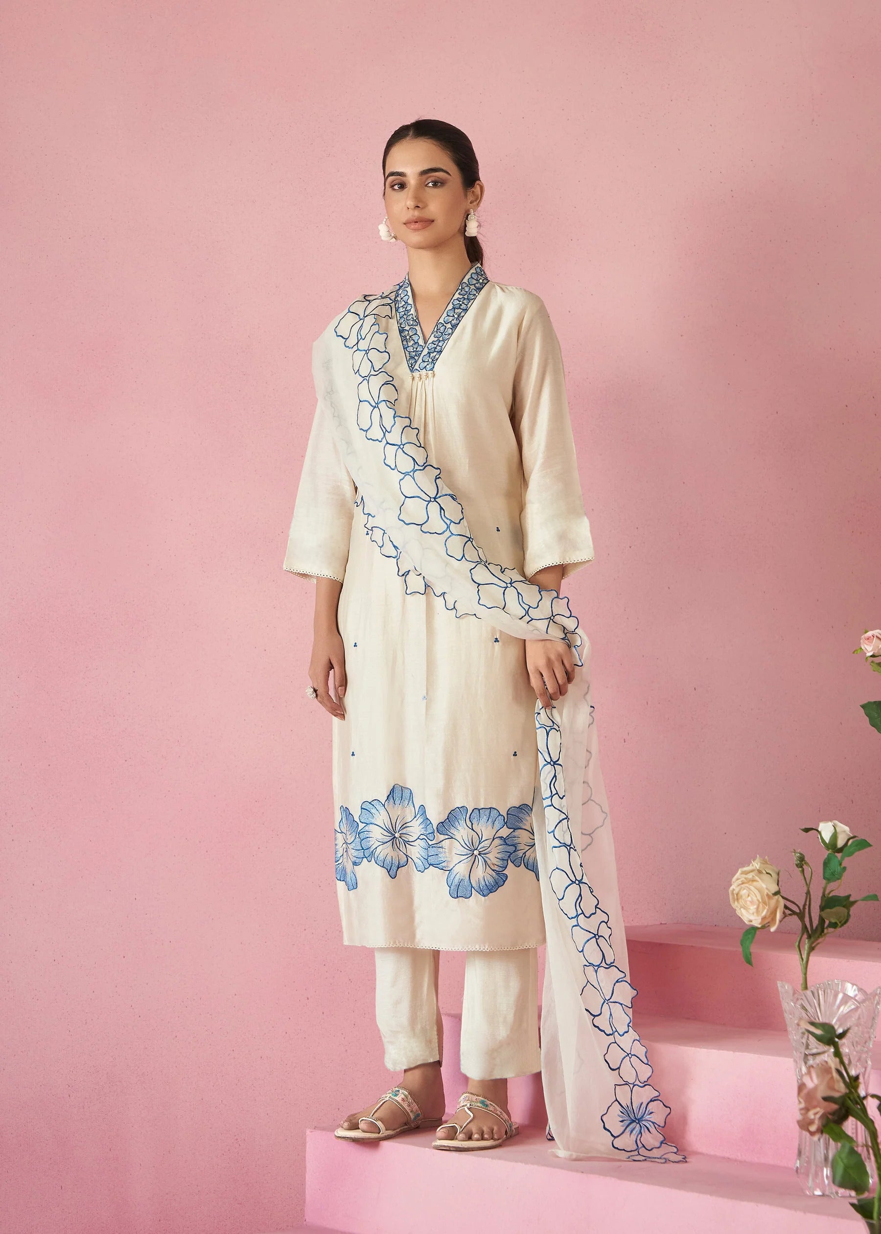 TRENDBUY model showcasing a full view of the white embroidered viscose rayon kurti, pant, and pure organza dupatta set.