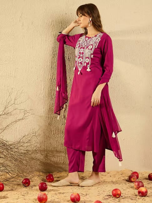 Side profile of TRENDBUY model in a stylish pink embroidered Kurti Pant with flowing Organza dupatta