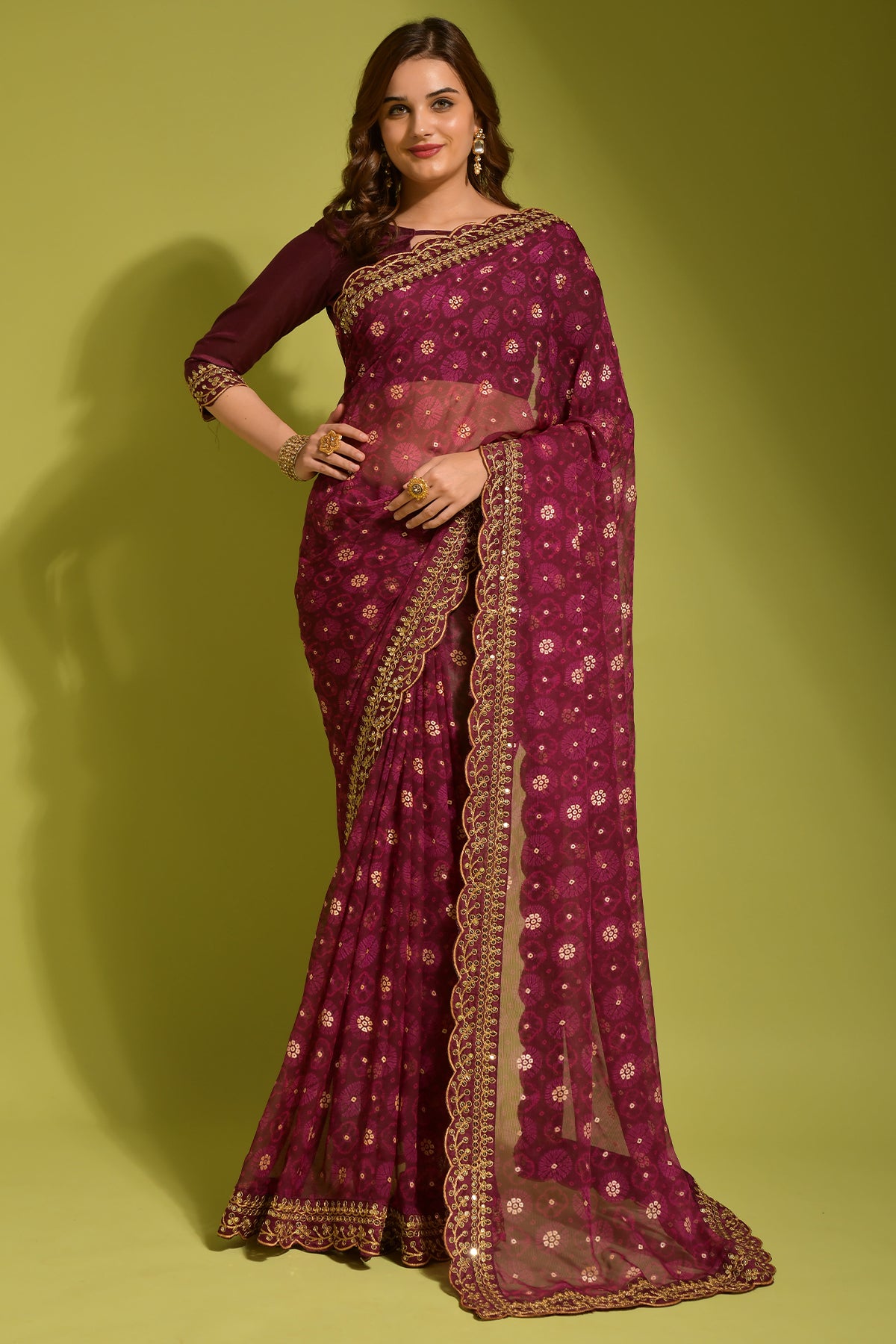 Exquisite wine georgette chiffon saree with floral print, foil, and sequin work, modeled.
