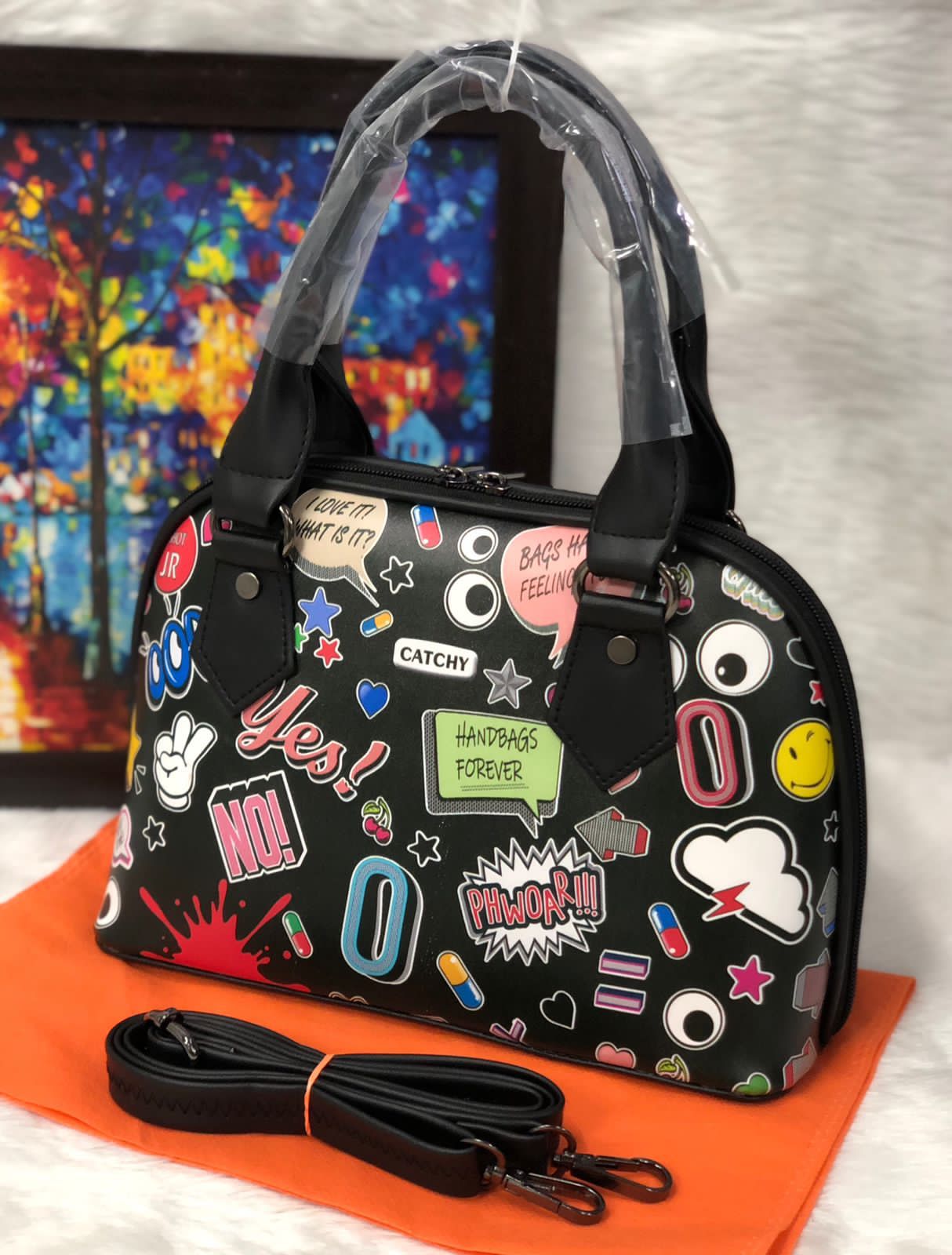Shop the Eye Theme Printed Leather Sling Handbag - Stylish and Functional