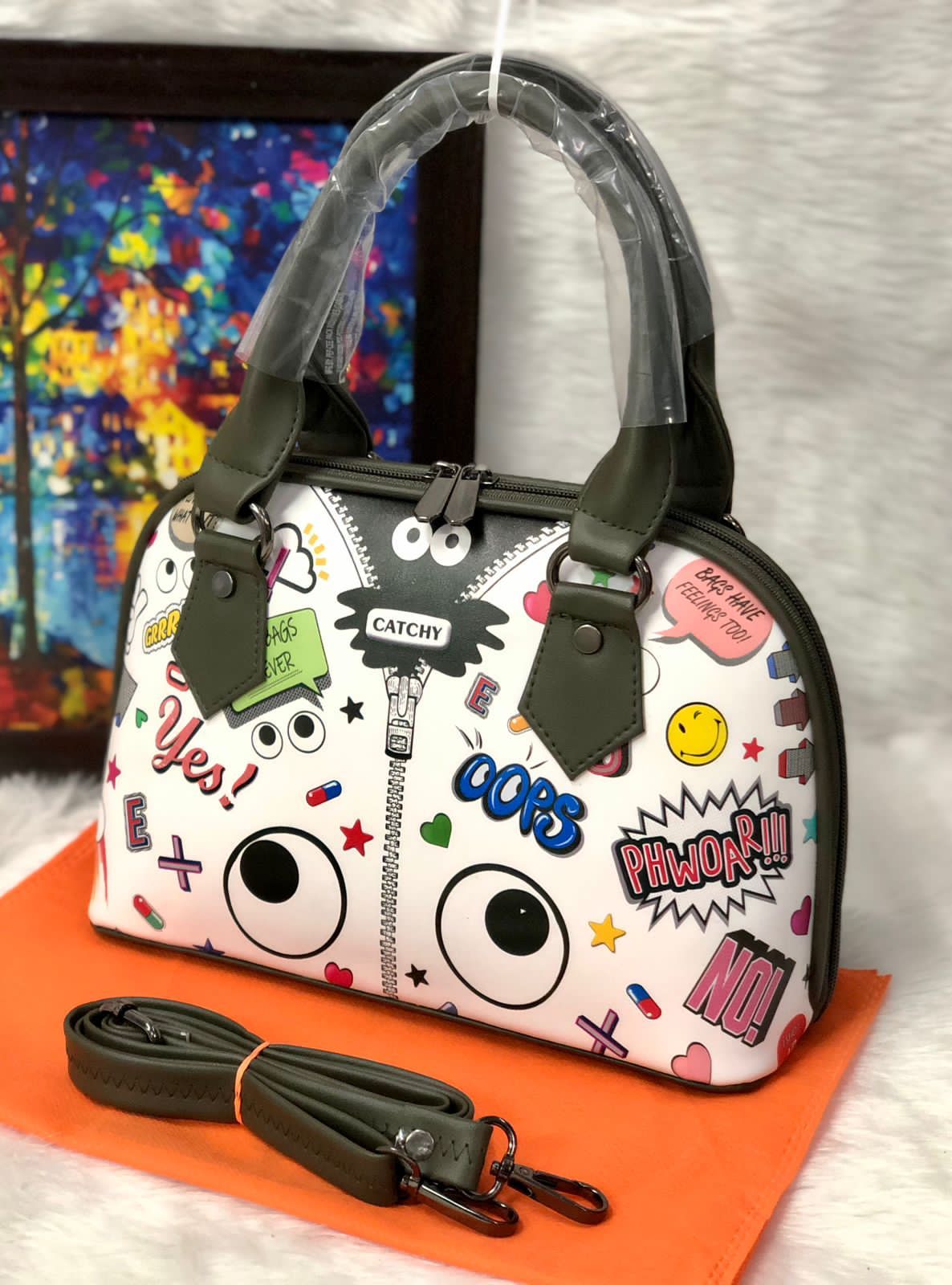 Shop the Eye Theme Printed Leather Sling Handbag - Stylish and Functional