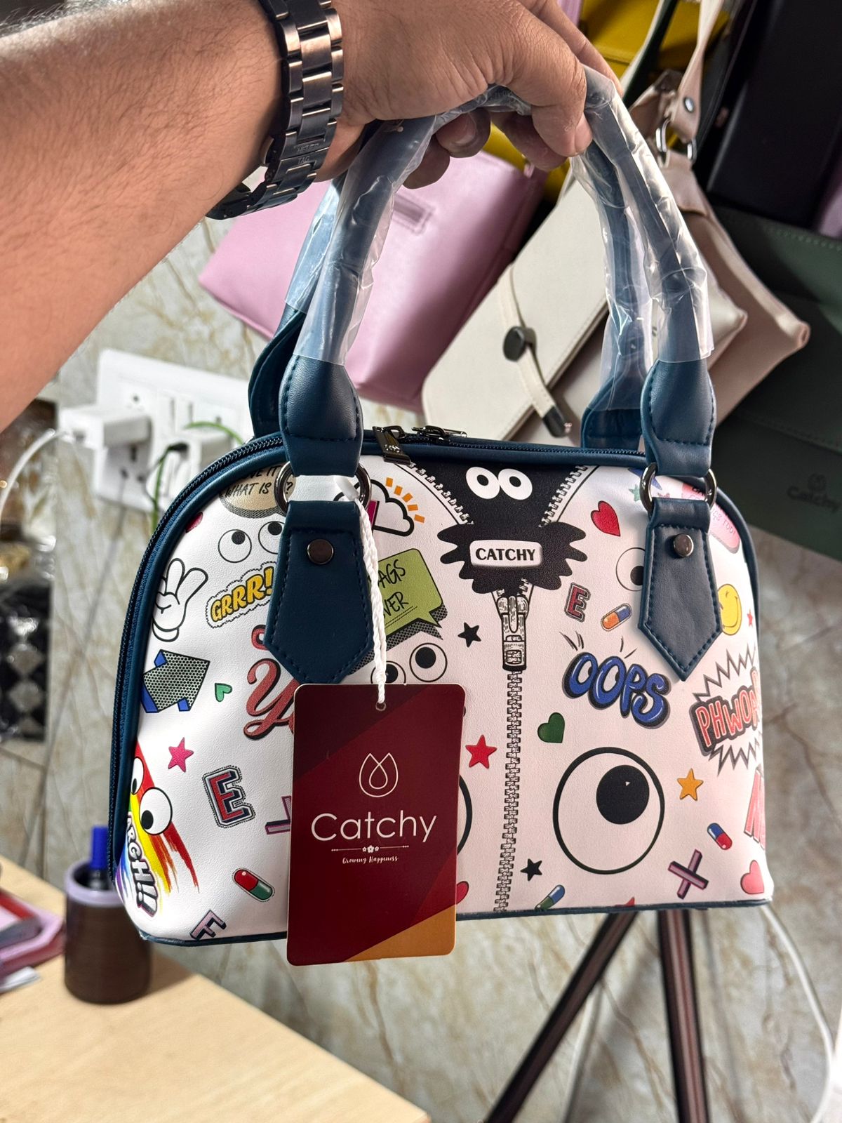 Shop the Eye Theme Printed Leather Sling Handbag - Stylish and Functional