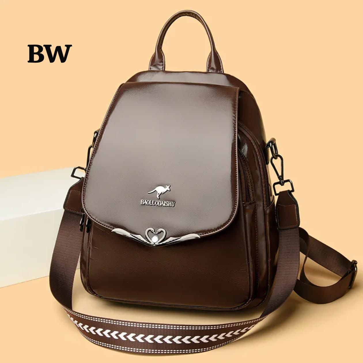 An elegant brown high-shine convertible bag with decorative flap hardware.