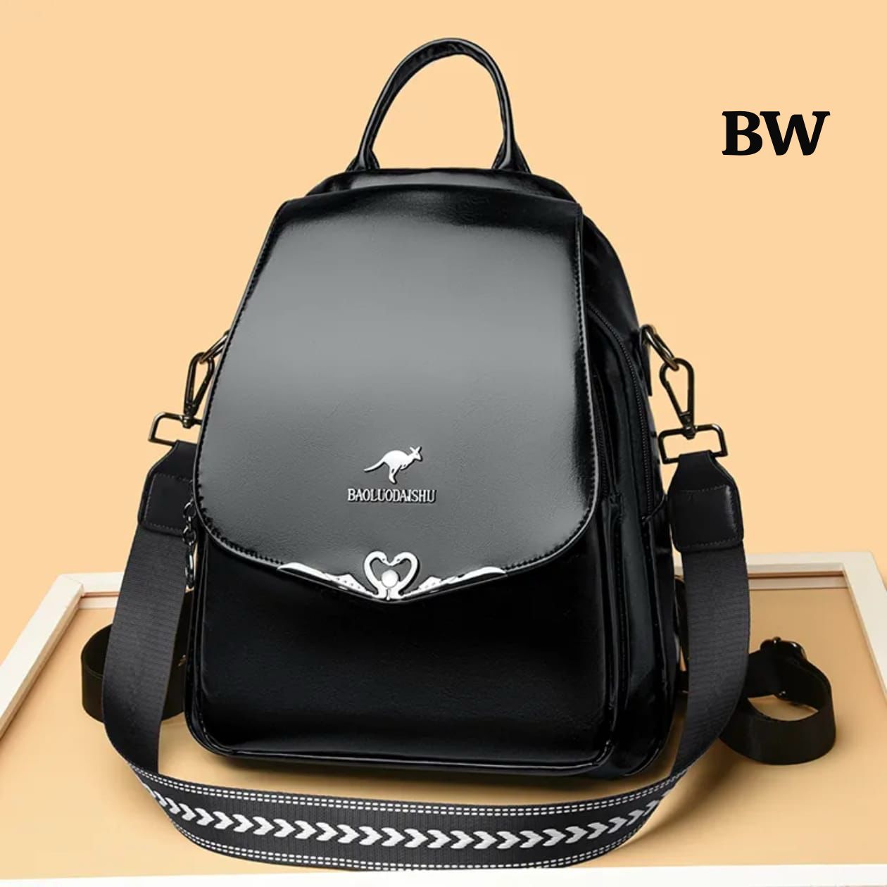 Black backpack with a brand logo on a beige background