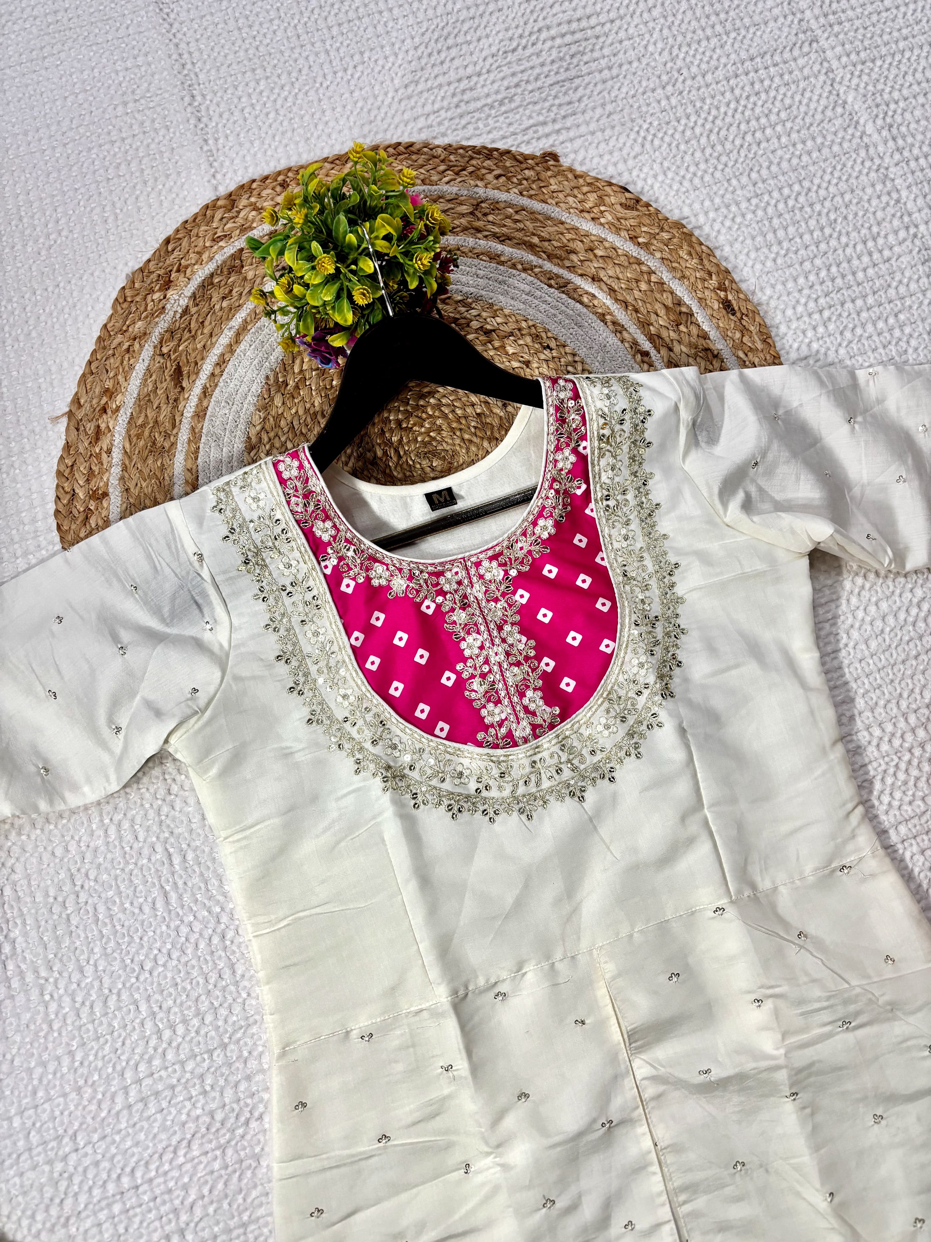 Flat lay of the cream kurta with hot pink coding sequence embroidered yoke from TRENDBUY K501 set, showcasing details.