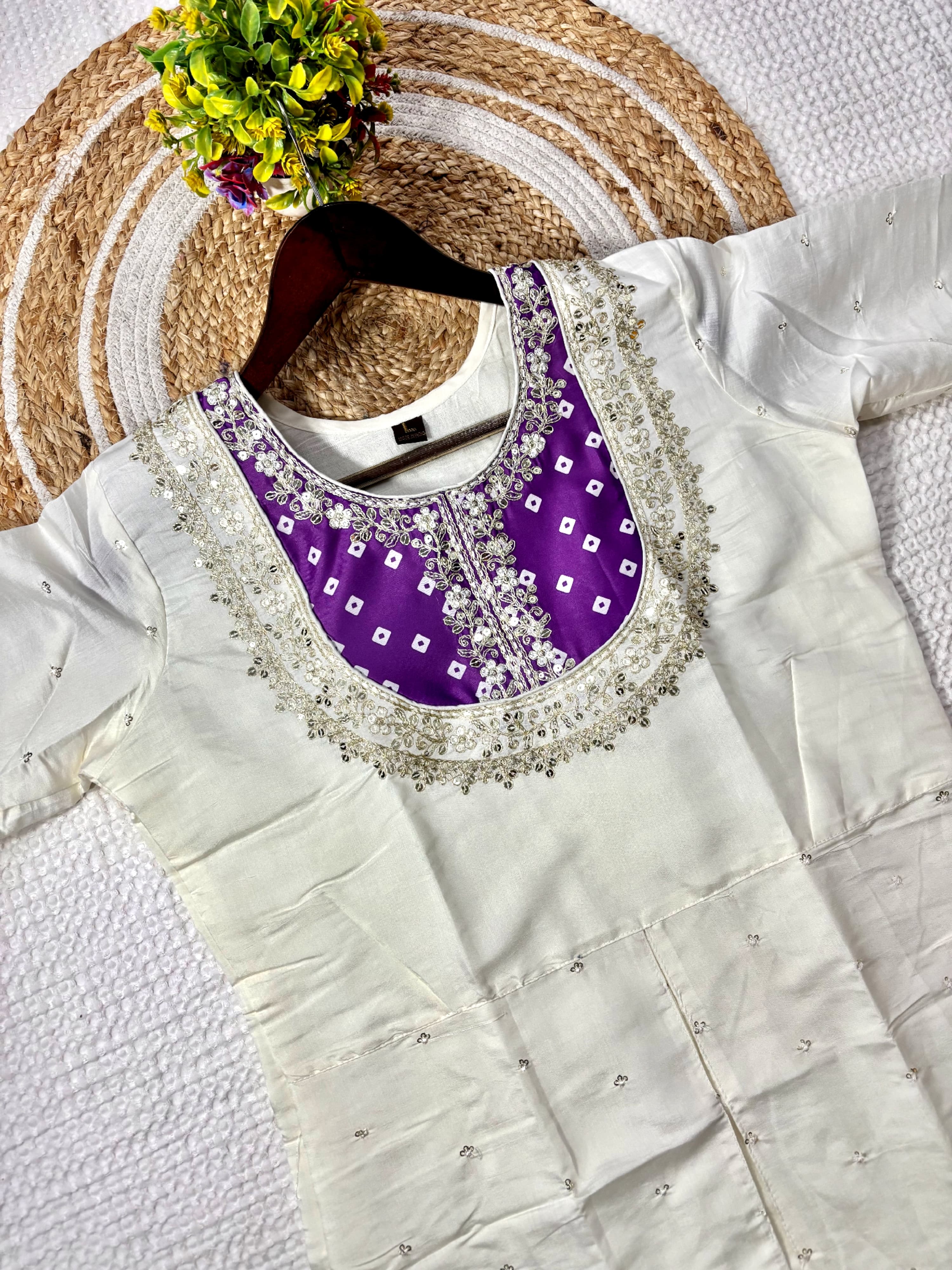 Close-up flat lay of the cream kurta's purple coding sequence embroidered yoke from TRENDBUY K501 set.