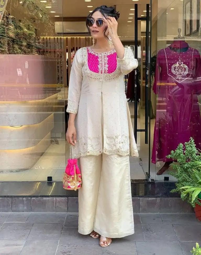 Model posing confidently in TRENDBUY K501 hot pink embroidered kurta palazzo set, wearing sunglasses.