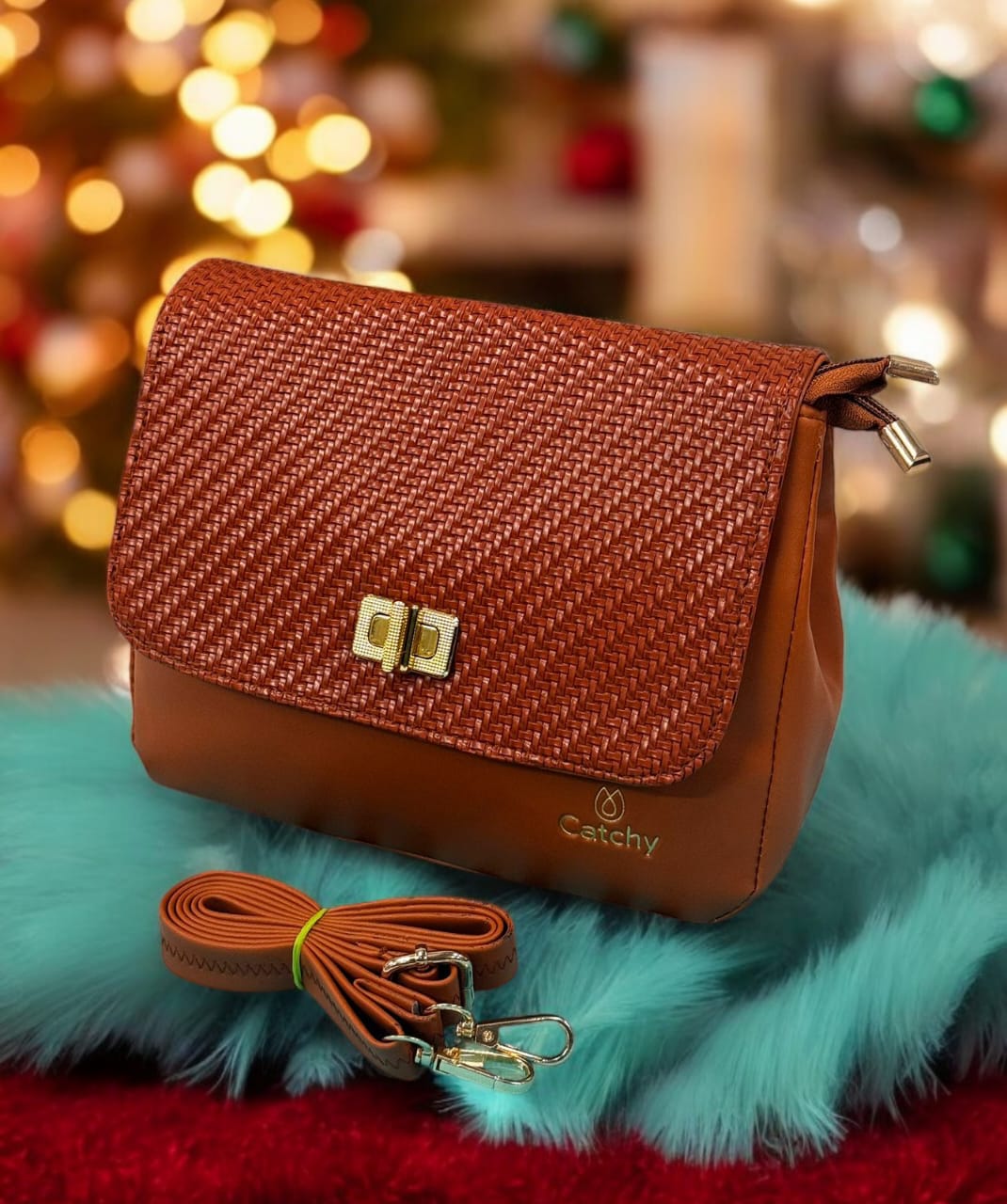 TRENDBUY Catchy Brown Faux Leather Crossbody Sling Bag with golden clasp and braided flap detail, on a festive background.