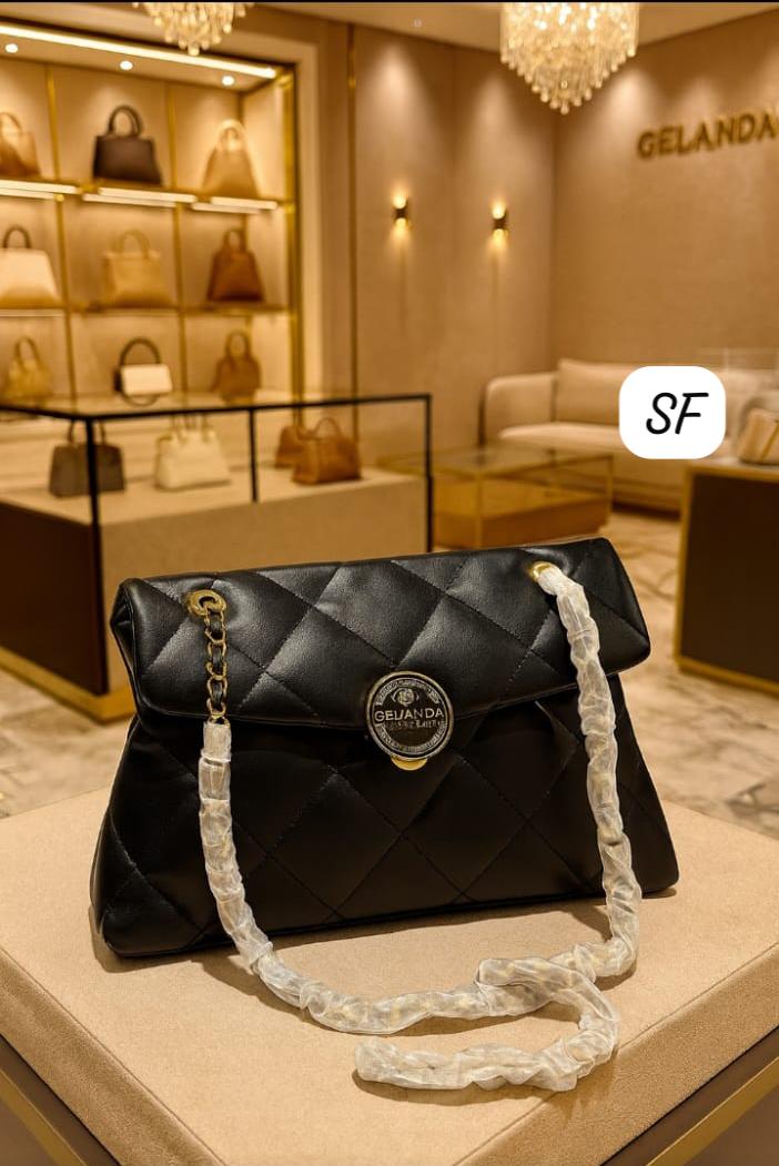 TRENDBUY Premium Black Quilted Sling Bag displayed elegantly in a luxury boutique setting.