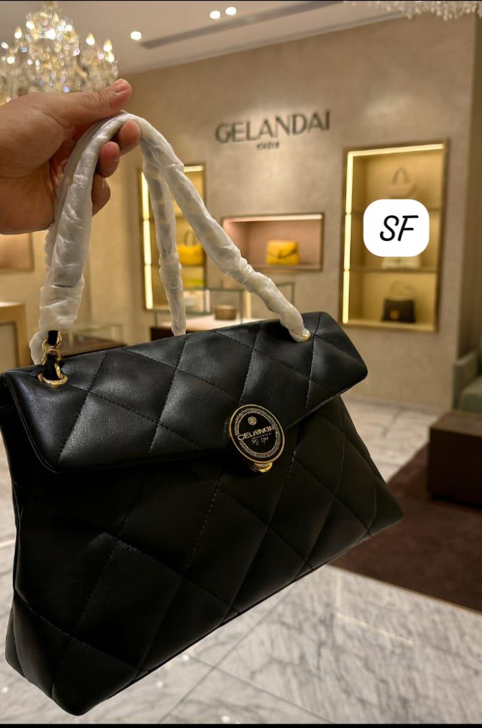 Side profile of the TRENDBUY Black Quilted Sling Bag, showcasing its structured form and sophisticated design.