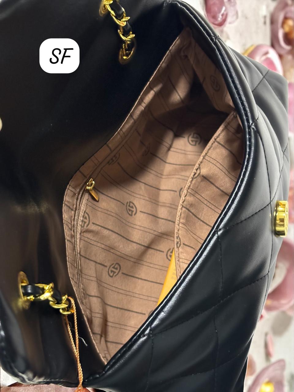 Interior view of the TRENDBUY Quilted Sling Bag, revealing a spacious main compartment and a practical zipper pocket with branded lining.