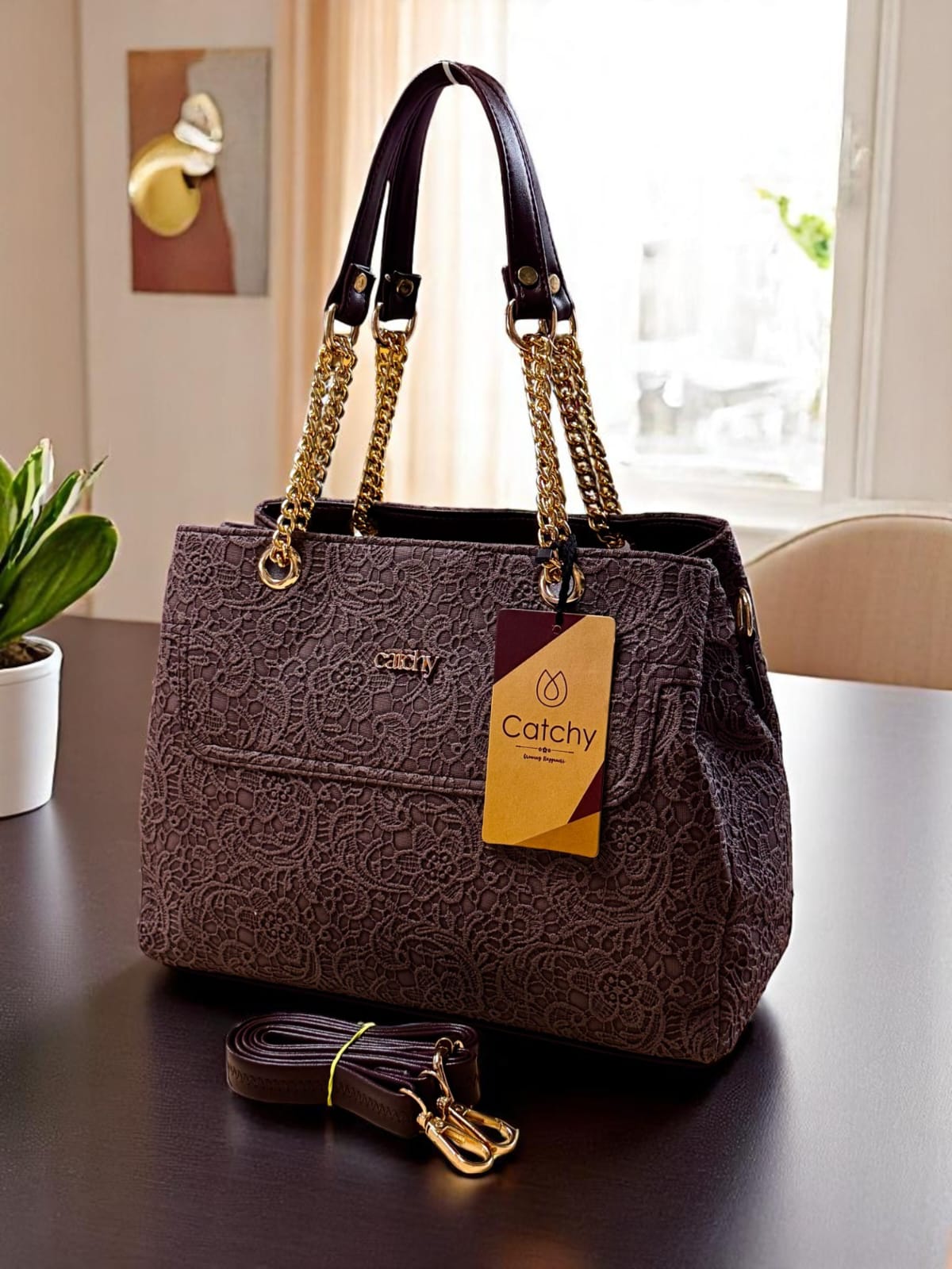 TRENDBUY Dark brown lace pattern handbag featuring luxurious gold chain handles and a matching adjustable strap.
