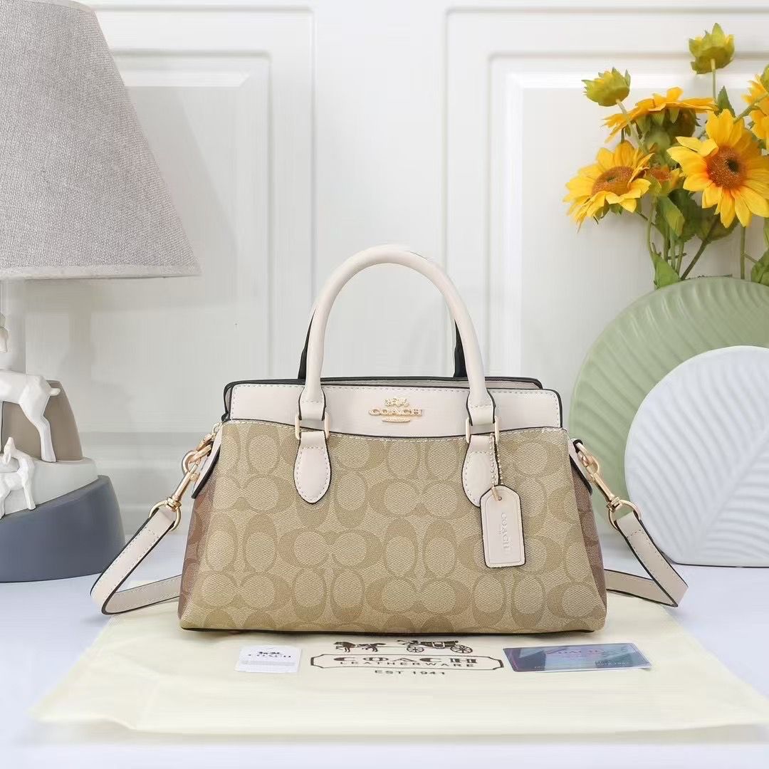 TRENDBUY Coach Darcie Handbag in beige signature canvas with off-white leather trim, gold hardware, and brand tag, presented with dust bag on a white surface.