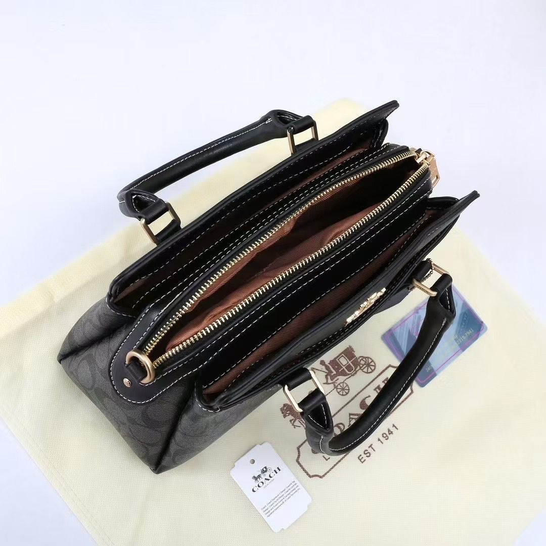 Overhead view of the open TRENDBUY Coach Darcie bag interior, revealing spacious compartments, a central zip pocket, and dark lining for organization.