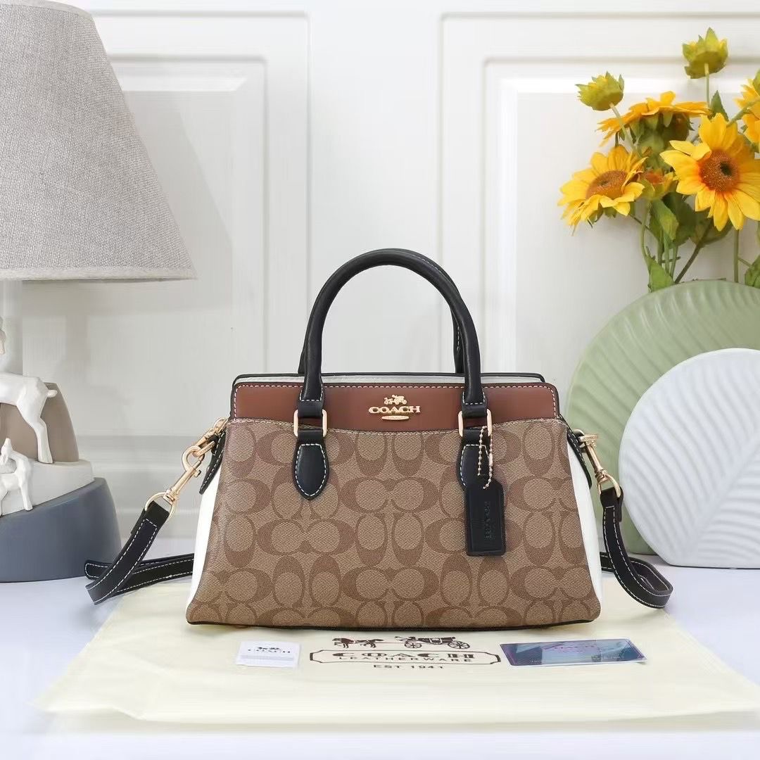 TRENDBUY Coach Darcie Handbag in a stylish multi-tone design with signature canvas, brown and white panels, and black leather accents, ready for any outfit.