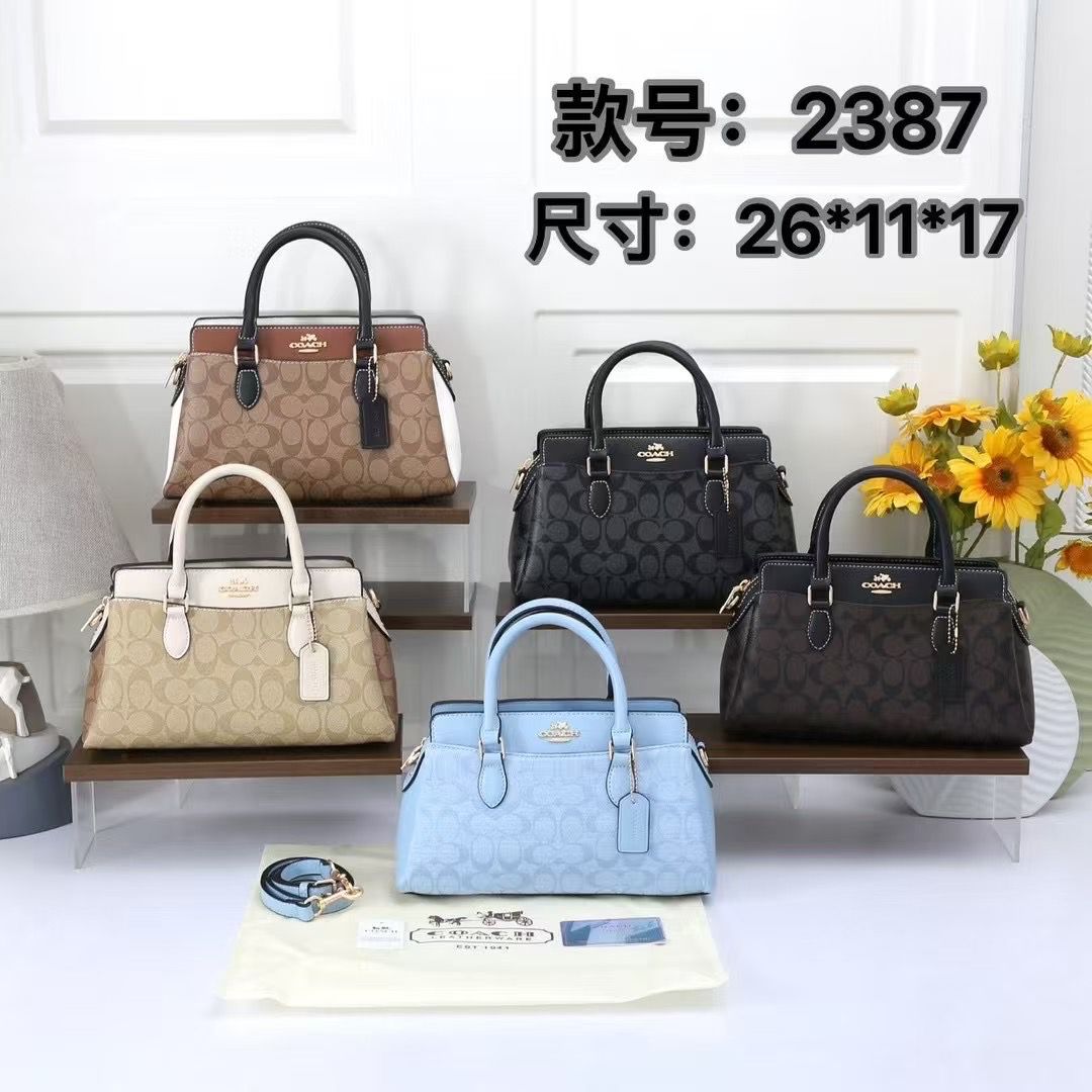 Collection of TRENDBUY Coach Darcie handbags displayed on shelves in various sophisticated colors including beige, light blue, dark brown, and black monogram patterns.