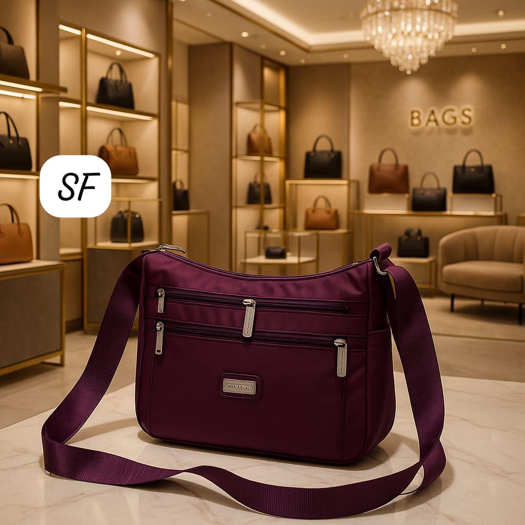 TRENDBUY classy purple multi-pocket sling bag on a marble counter amidst other designer bags