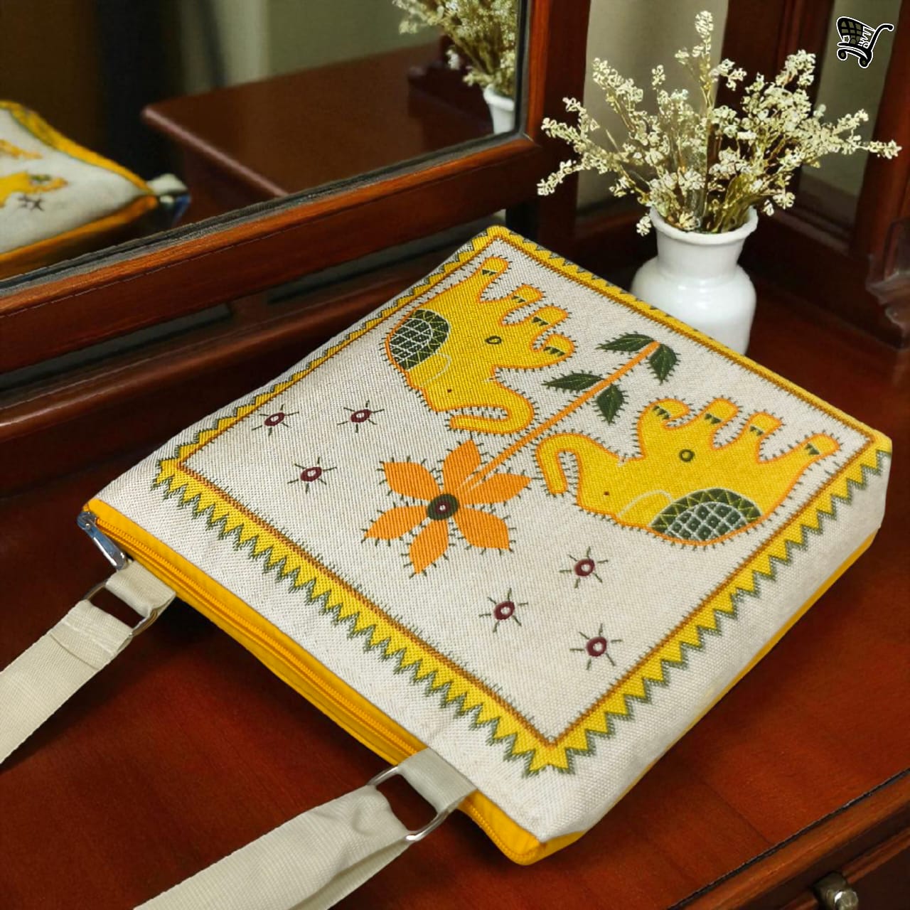 Close-up of TRENDBUY yellow elephant print jute sling bag, showcasing its top zippered closure and texture.