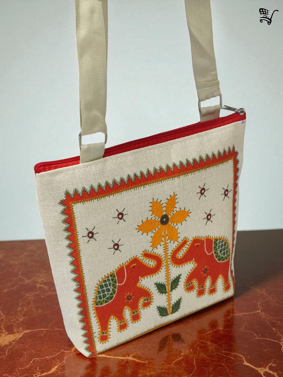 TRENDBUY red elephant print jute crossbody bag, with strap, against a simple white background.