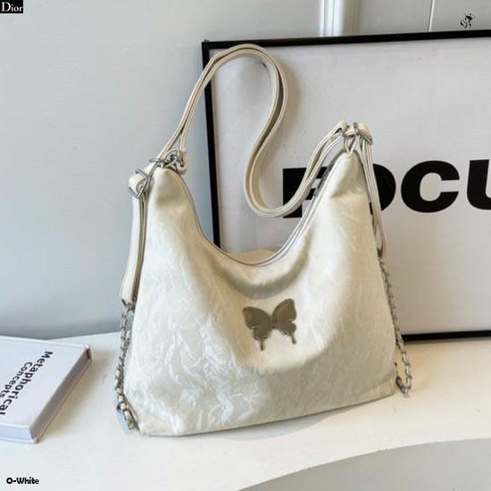 Elegant off-white (cream) 2-in-1 backpack tote bag with a unique crinkled texture and central butterfly detail.