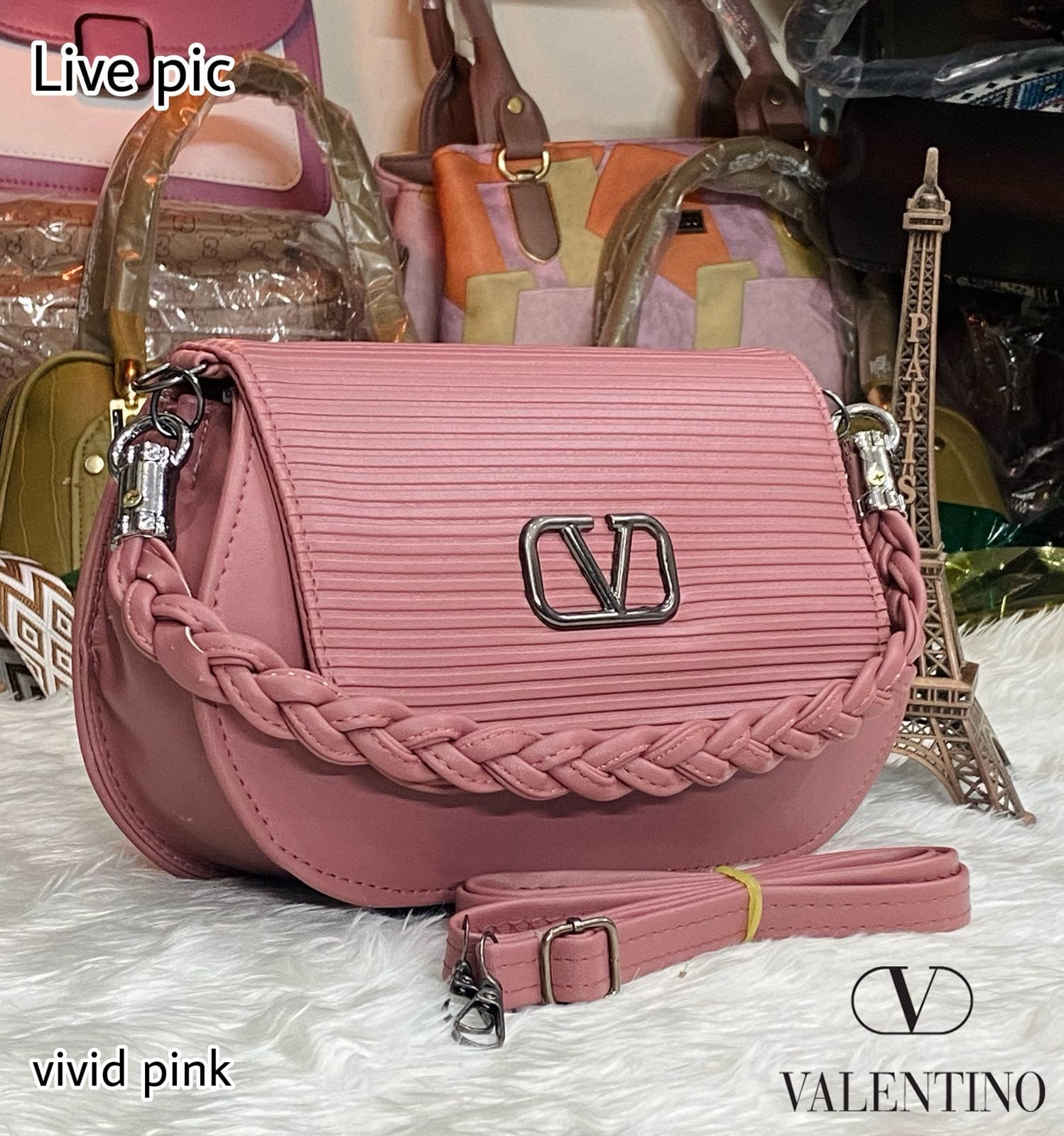 TRENDBUY Vivid Pink Valentino-inspired shoulder bag, showcasing textured flap and V logo.