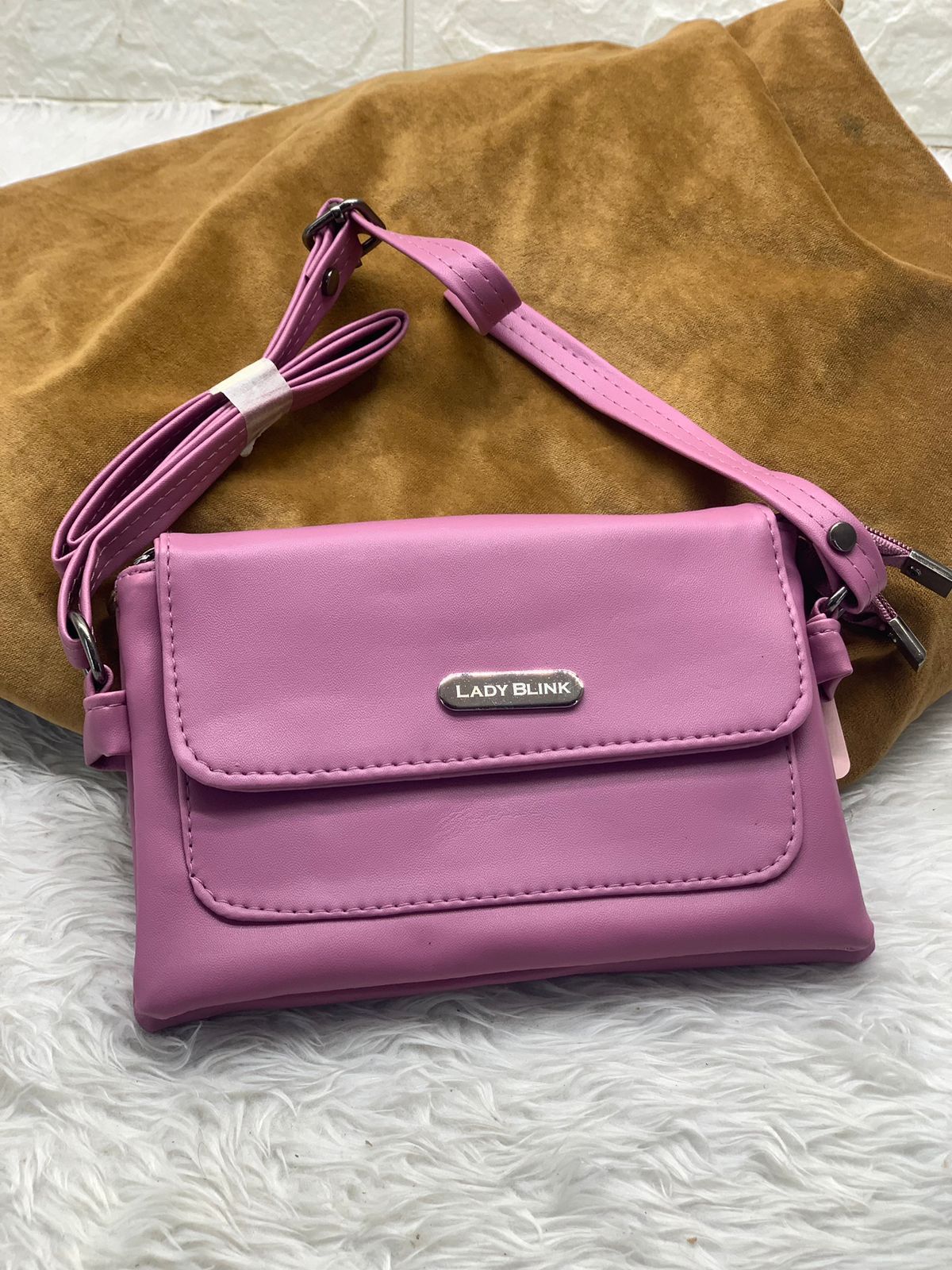 TRENDBUY bright pink PU leather sling bag, perfect accessory for women and girls.
