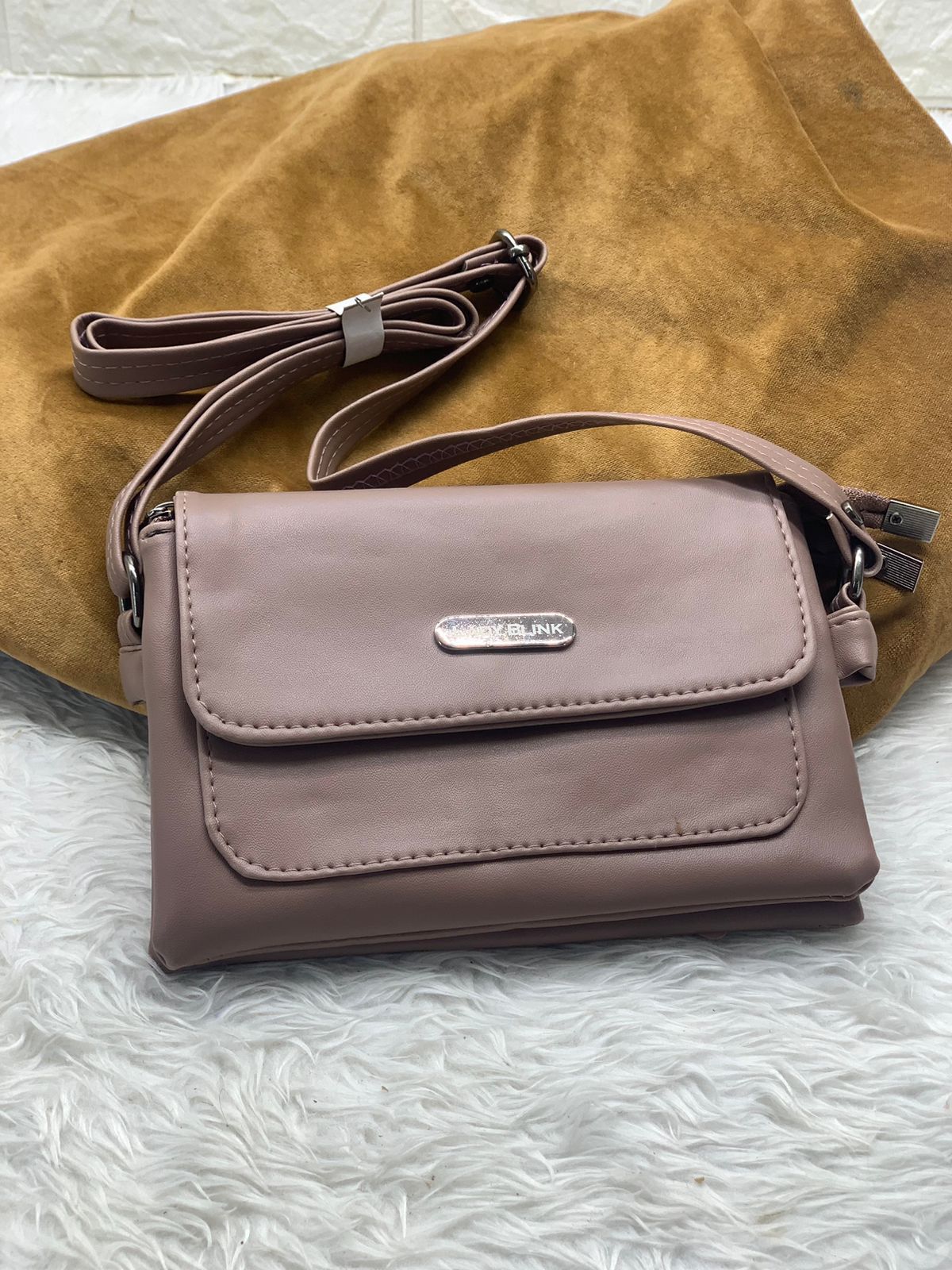 TRENDBUY mauve pink PU leather sling bag, stylish and practical for daily use.