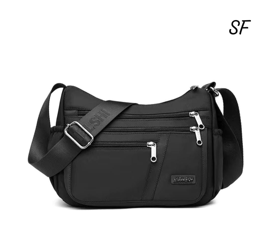 TRENDBUY Black Imported Crossbody Bag, front view, highlighting its sleek design and practicality.