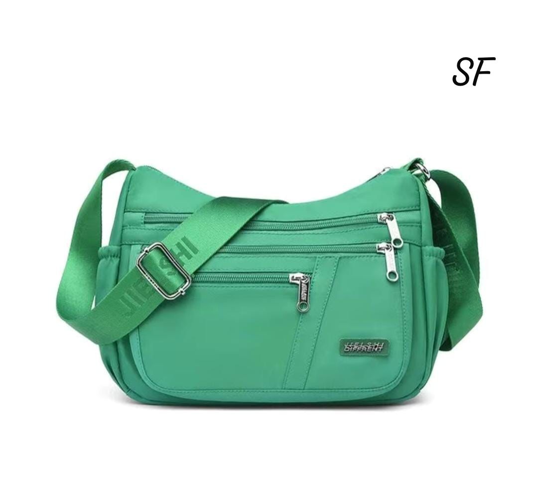 TRENDBUY Emerald Green Premium Sling Bag, a vibrant and stylish accessory for a pop of color.