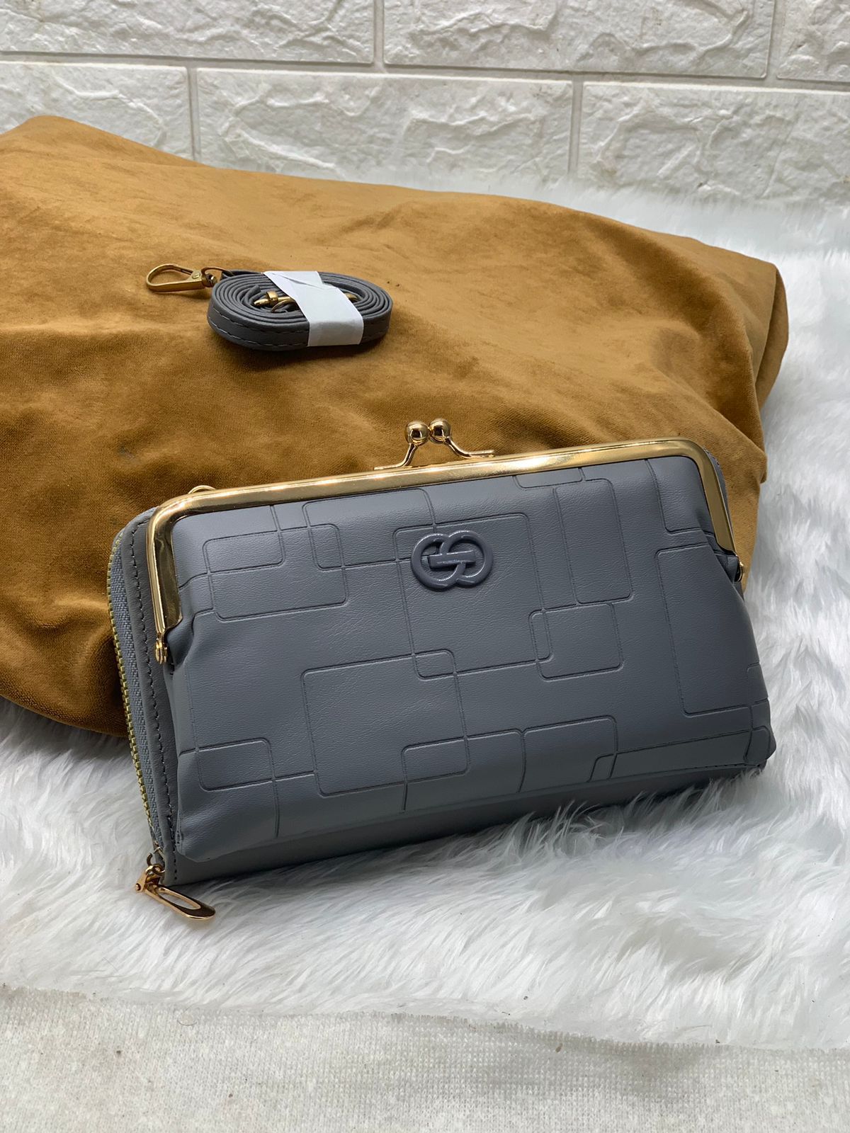 TRENDBUY grey PU leather wallet sling bag with gold clasp and zipper, showing detachable strap.