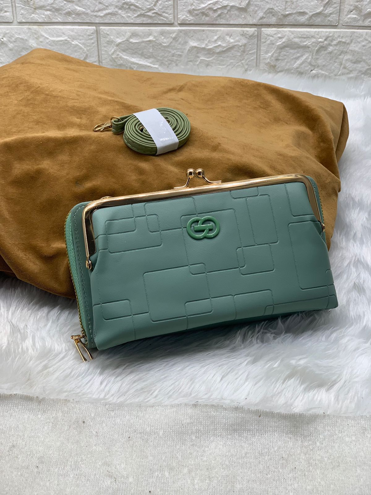 TRENDBUY teal green PU leather wallet sling bag, front view on a textured background.