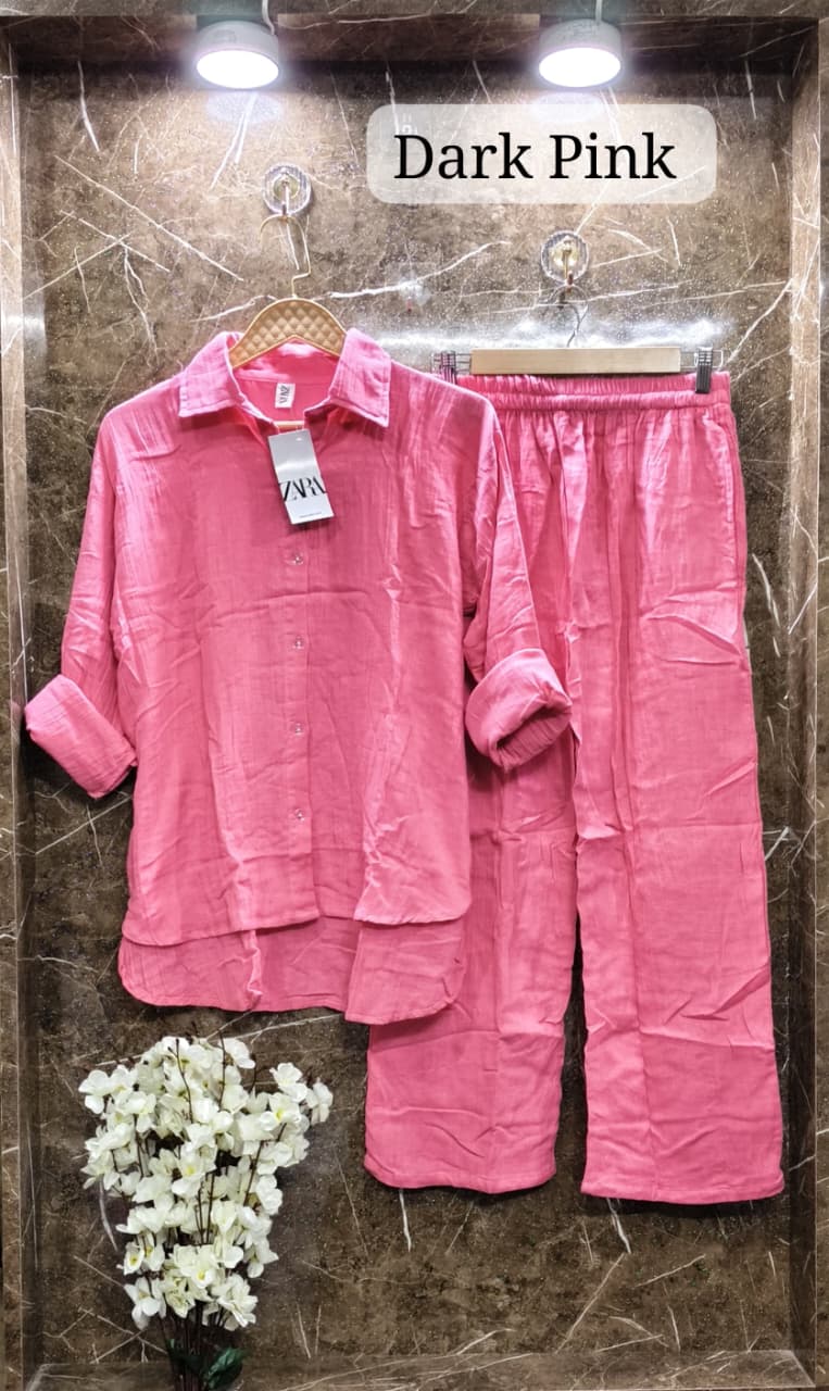 Bold Dark Pink Mul Mul Cotton Cord Set, with a Zara tag, offering a vibrant statement on marble.