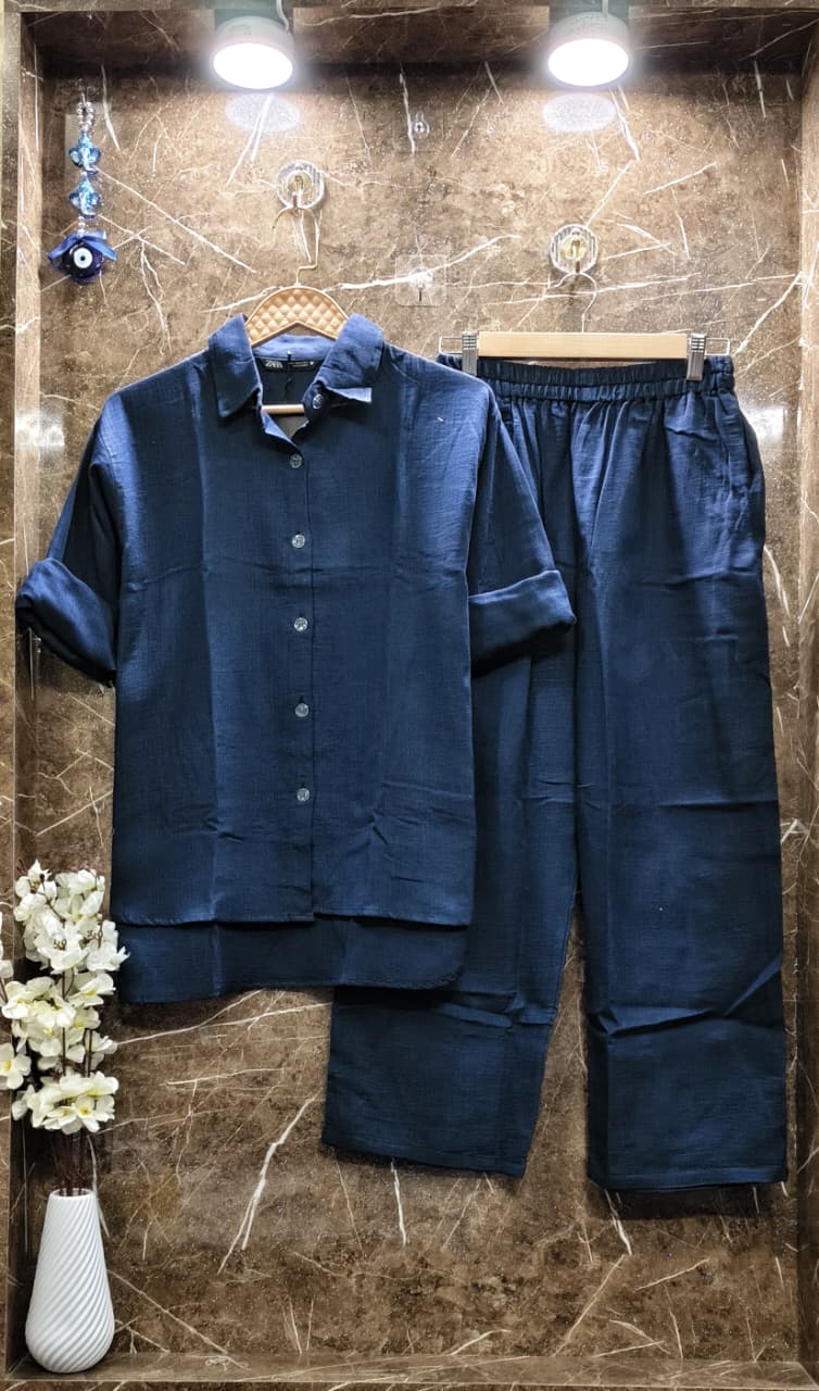 Classic Navy Blue Mul Mul Cotton Cord Set, providing a timeless and versatile option against marble.