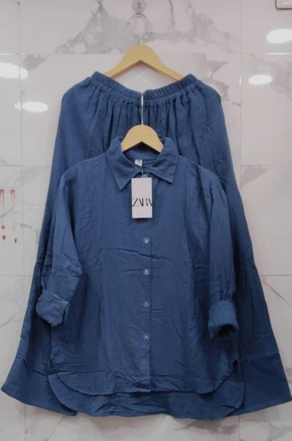 Full view of Navy Blue Mul Mul Cotton Cord Set, displaying complete outfit against a white marble wall.