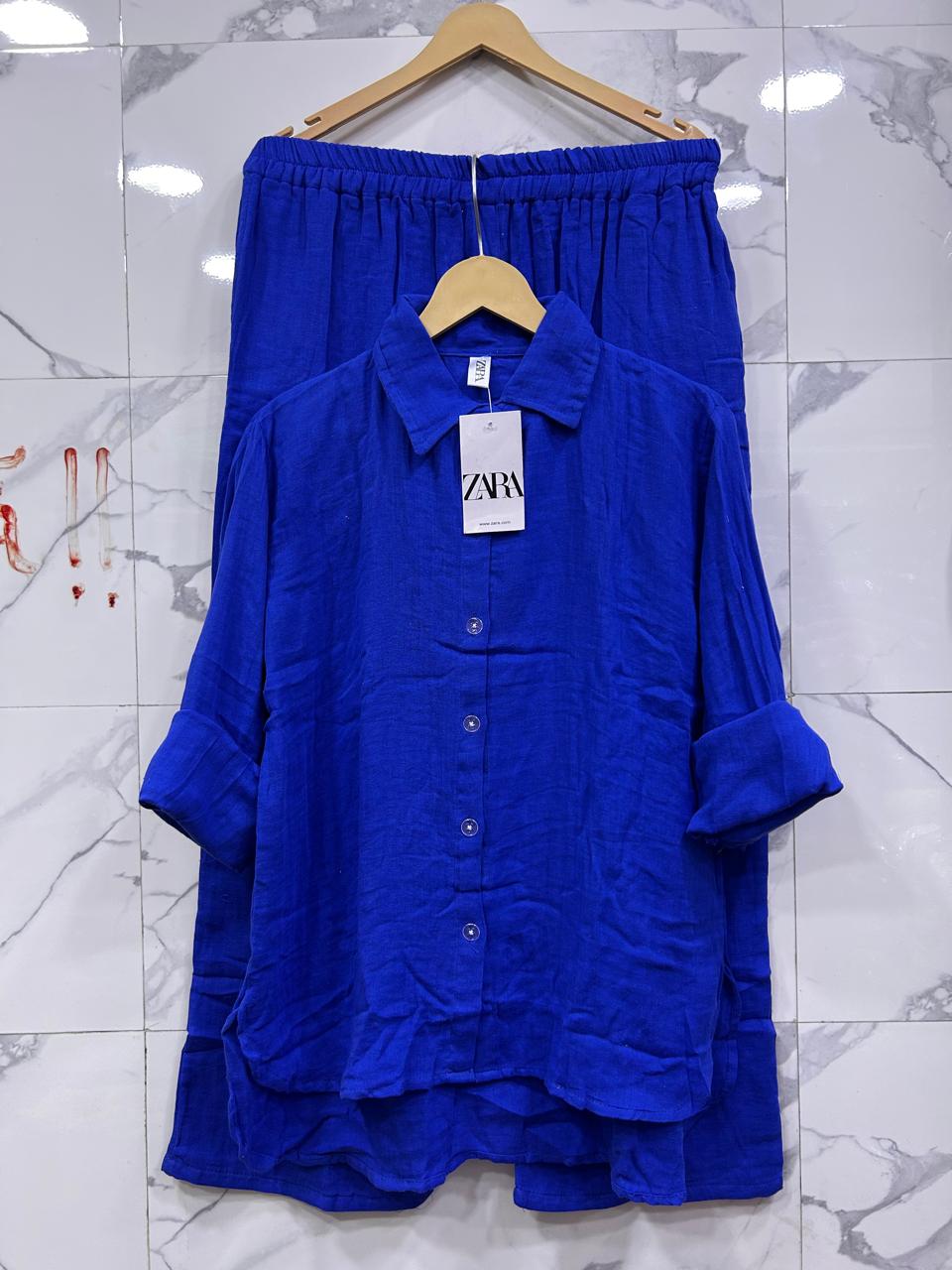 Full view of Royal Blue Mul Mul Cotton Cord Set, capturing the entire silhouette on a clean marble wall.