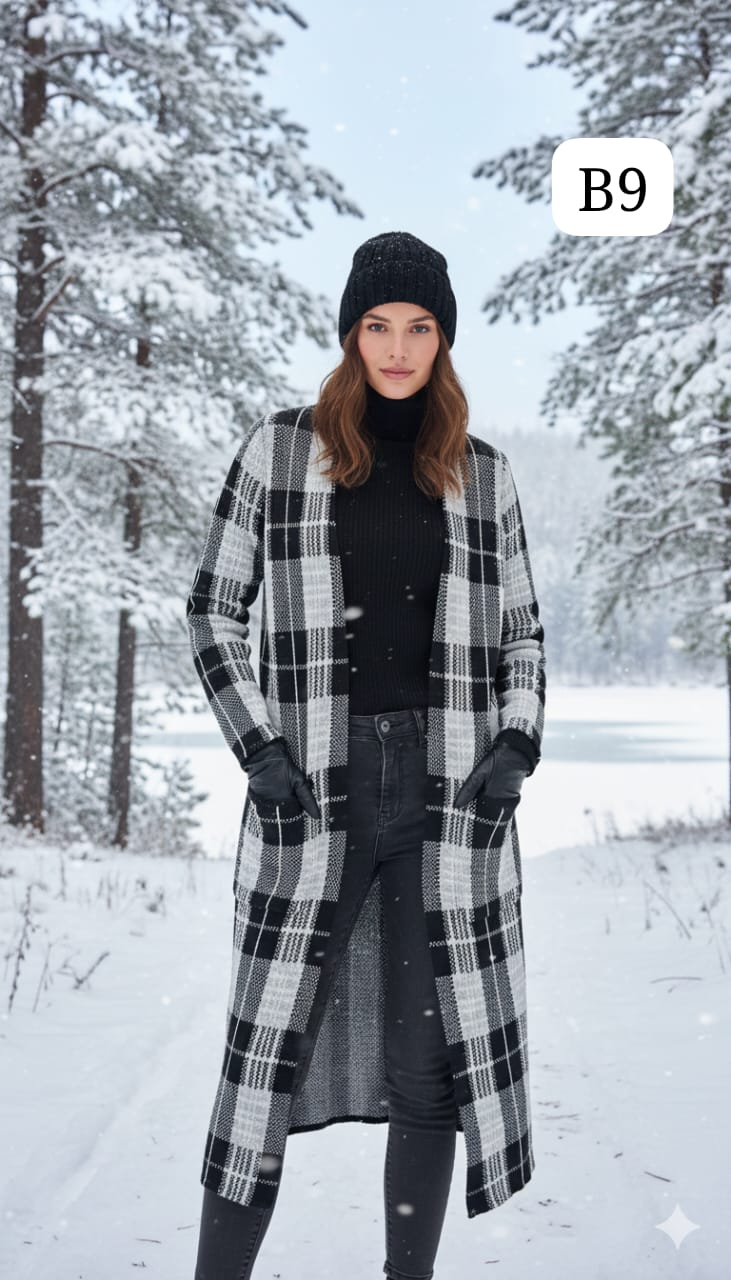 TRENDBUY women's B9 black and white plaid longline cardigan shrug, styled with a black beanie in a serene snowy forest.