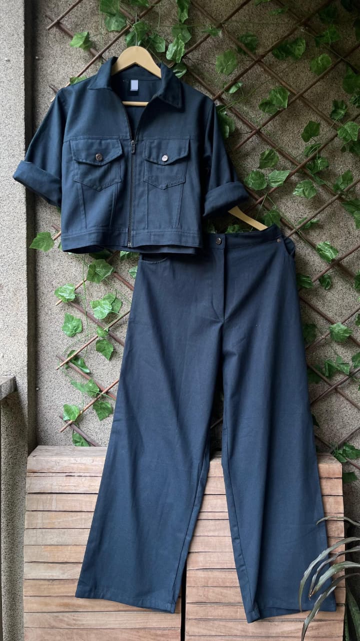 Teal blue twill denim zipper crop jacket and matching wide leg pants co-ord set displayed on a hanger.