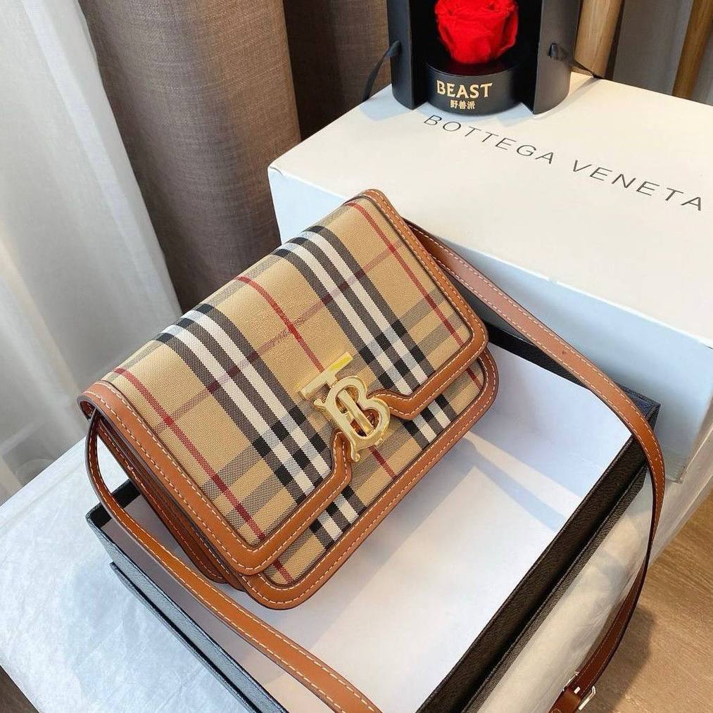 TRENDBUY Burberry style classic crossbody sling bag in beige check pattern with gold TB logo hardware, displayed on a white box.