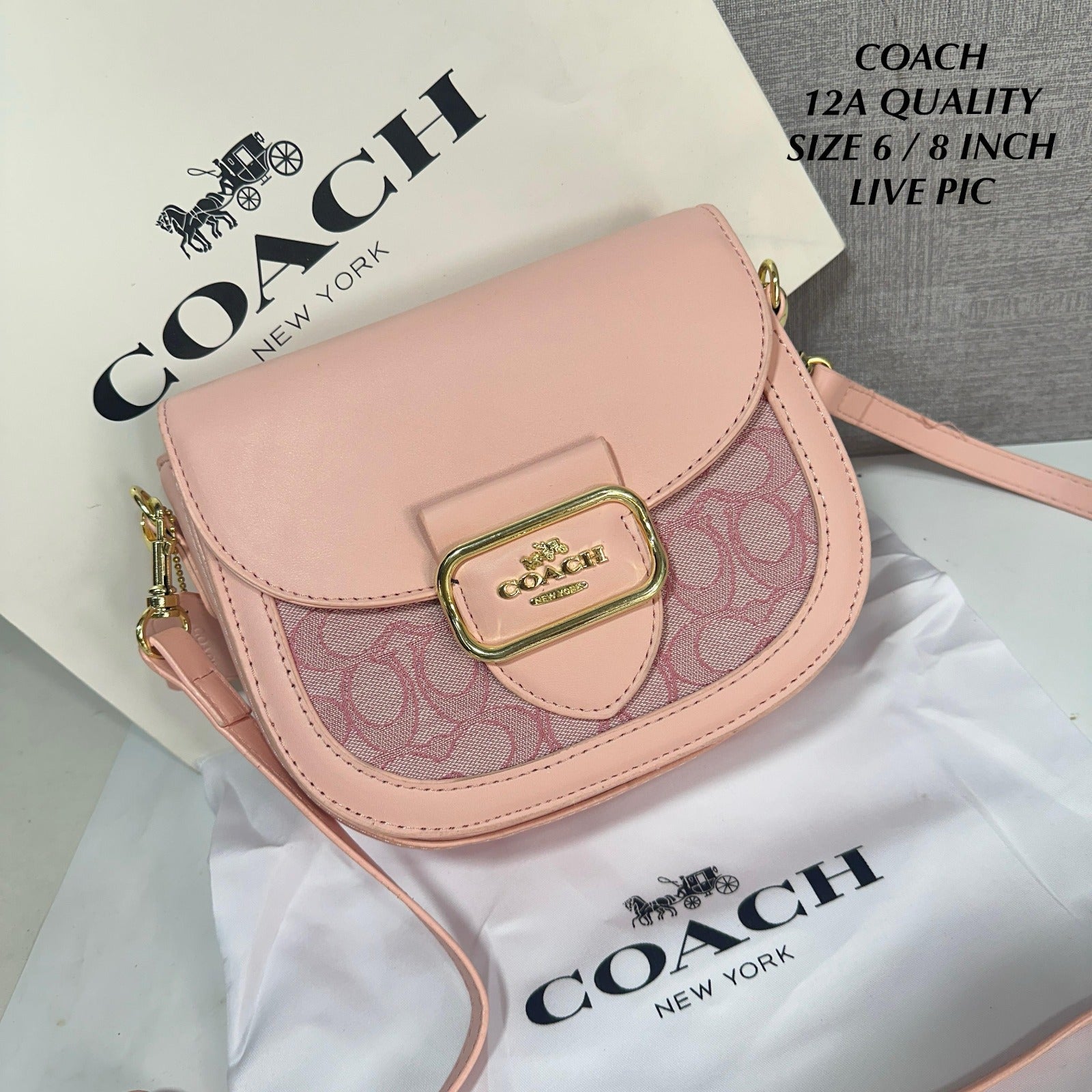 TRENDBUY exclusive Coach Morgan Saddle Bag in pink signature chambray, showcasing gold hardware and a brand dustcover.