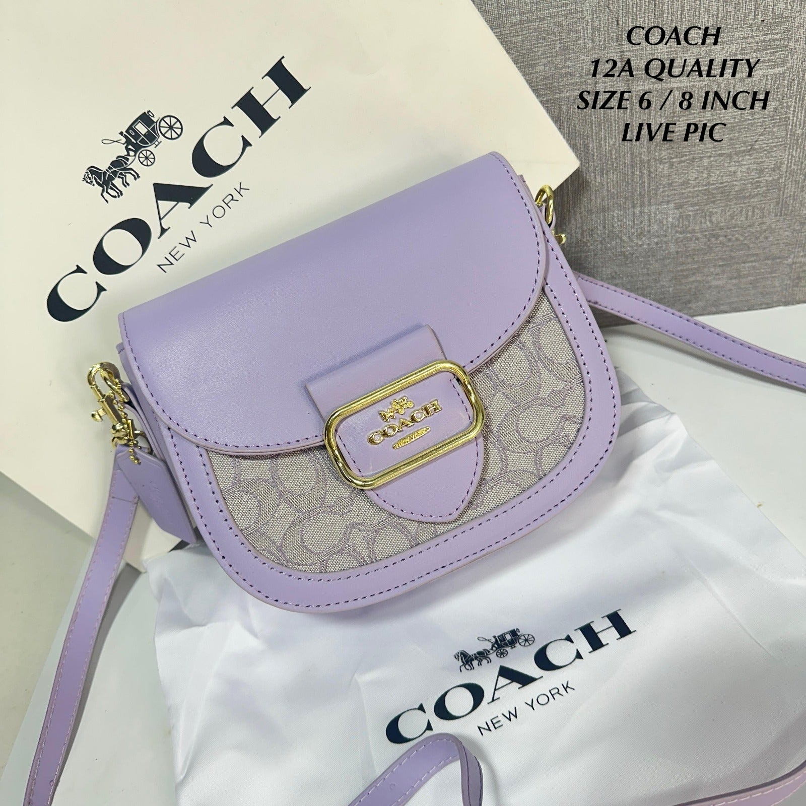 Luxurious Coach Morgan Saddle Bag in lavender signature chambray, featuring gold buckle detail and presented with a brand dustcover and shopping bag.