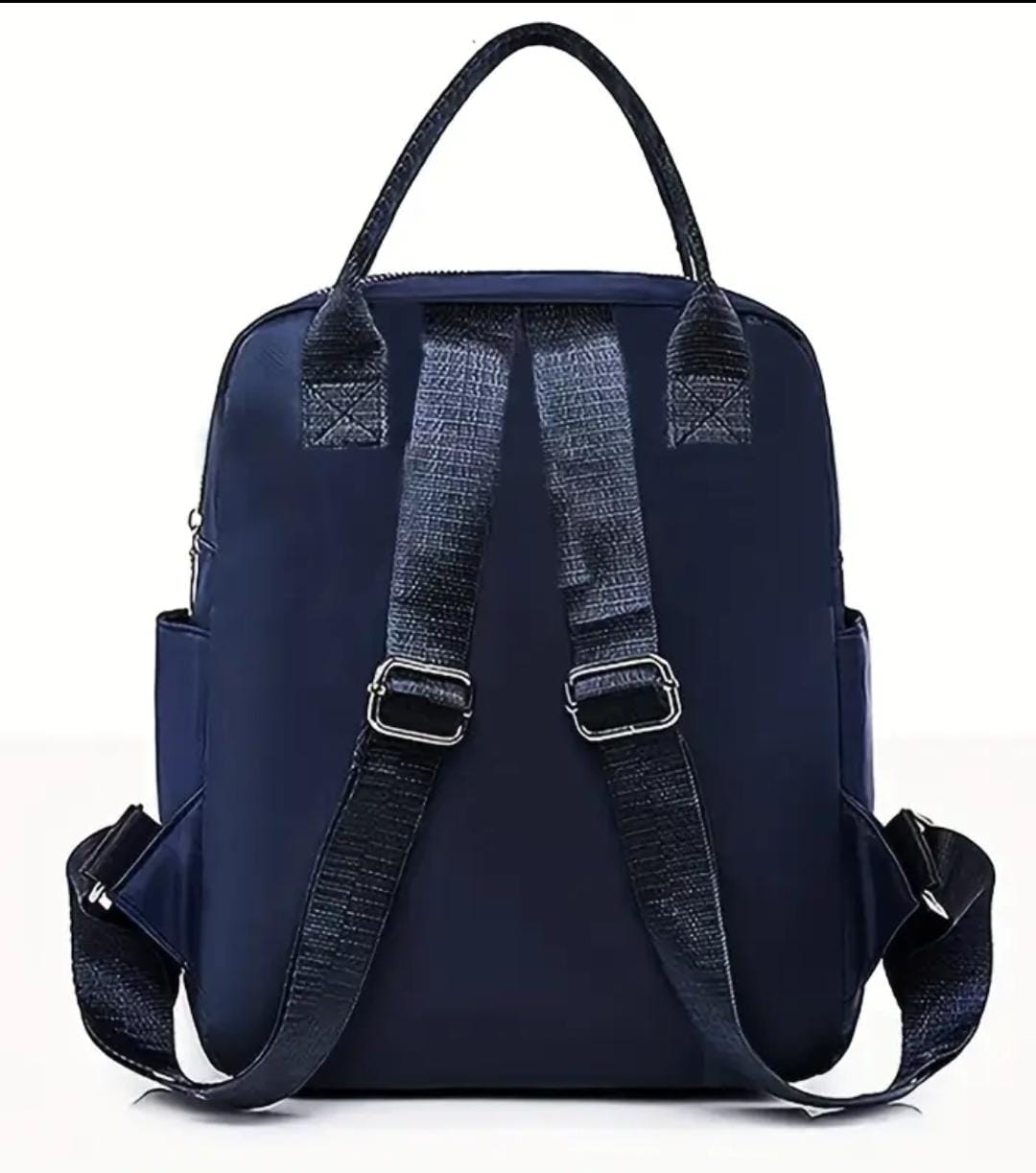 Back view of the navy blue quilted nylon backpack, focusing on the comfortable, adjustable shoulder straps.