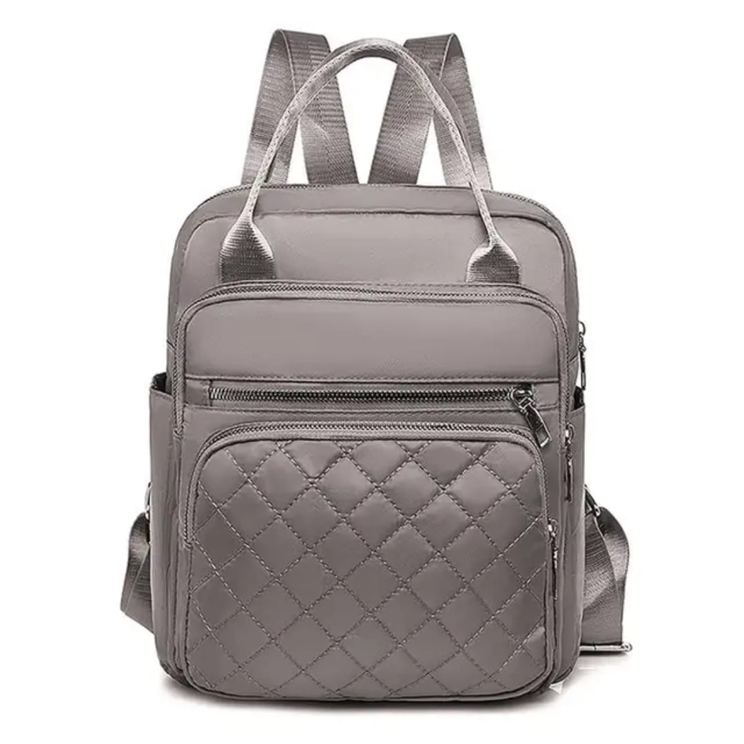 Front view of the sleek grey quilted nylon backpack, presenting its minimalist and functional design.