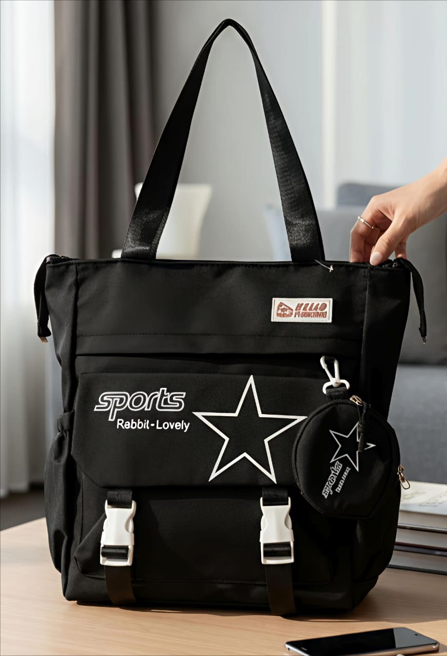 TRENDBUY Black imported tote bag with star design and matching coin pouch, displayed on a wooden table.